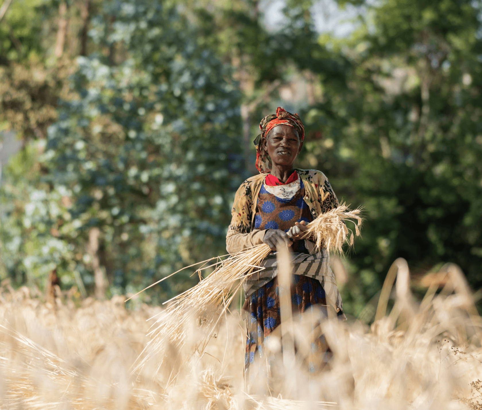 woman smiling with farm harvest