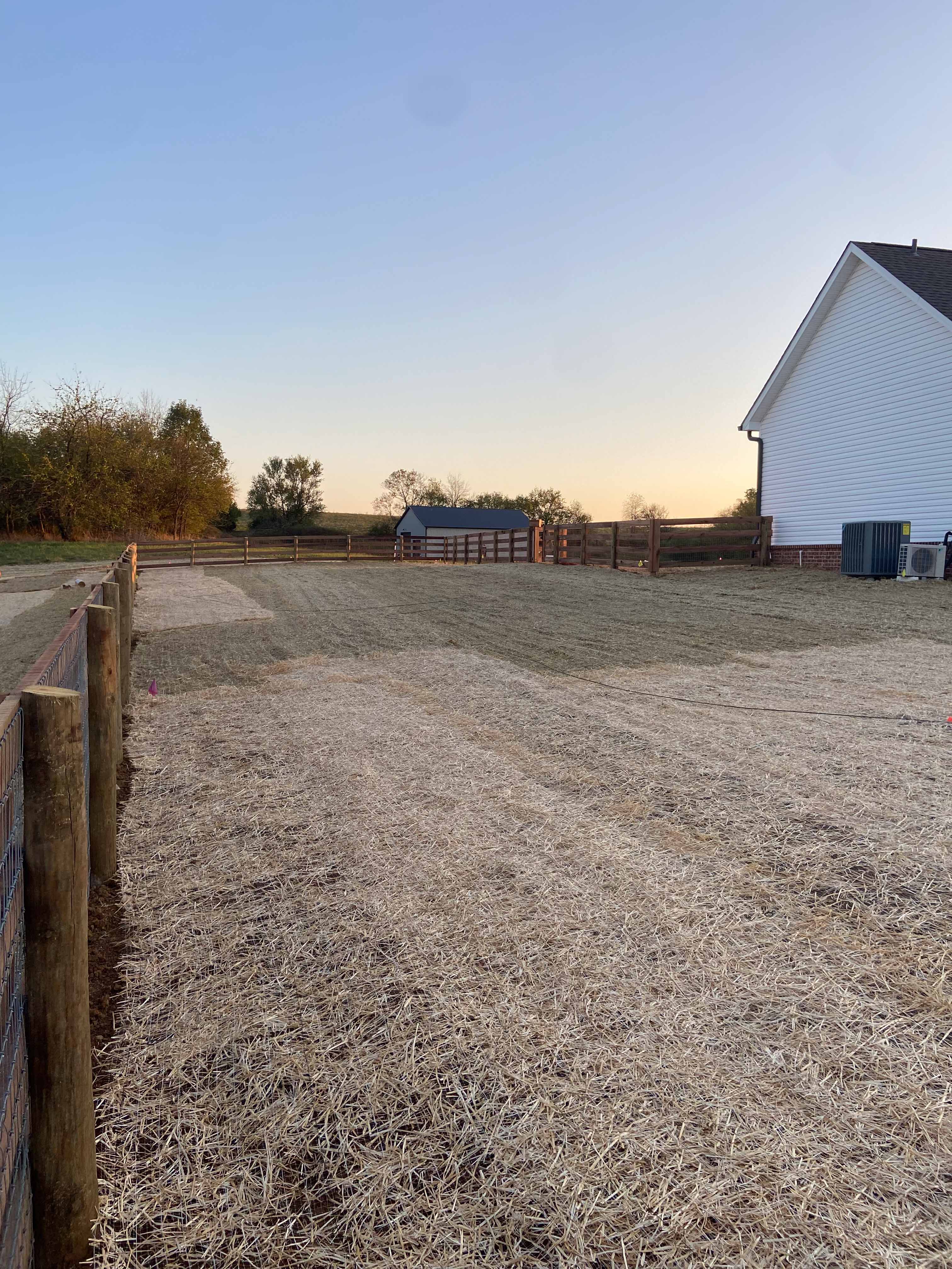 Backyard view showing patio and fenced lawn area