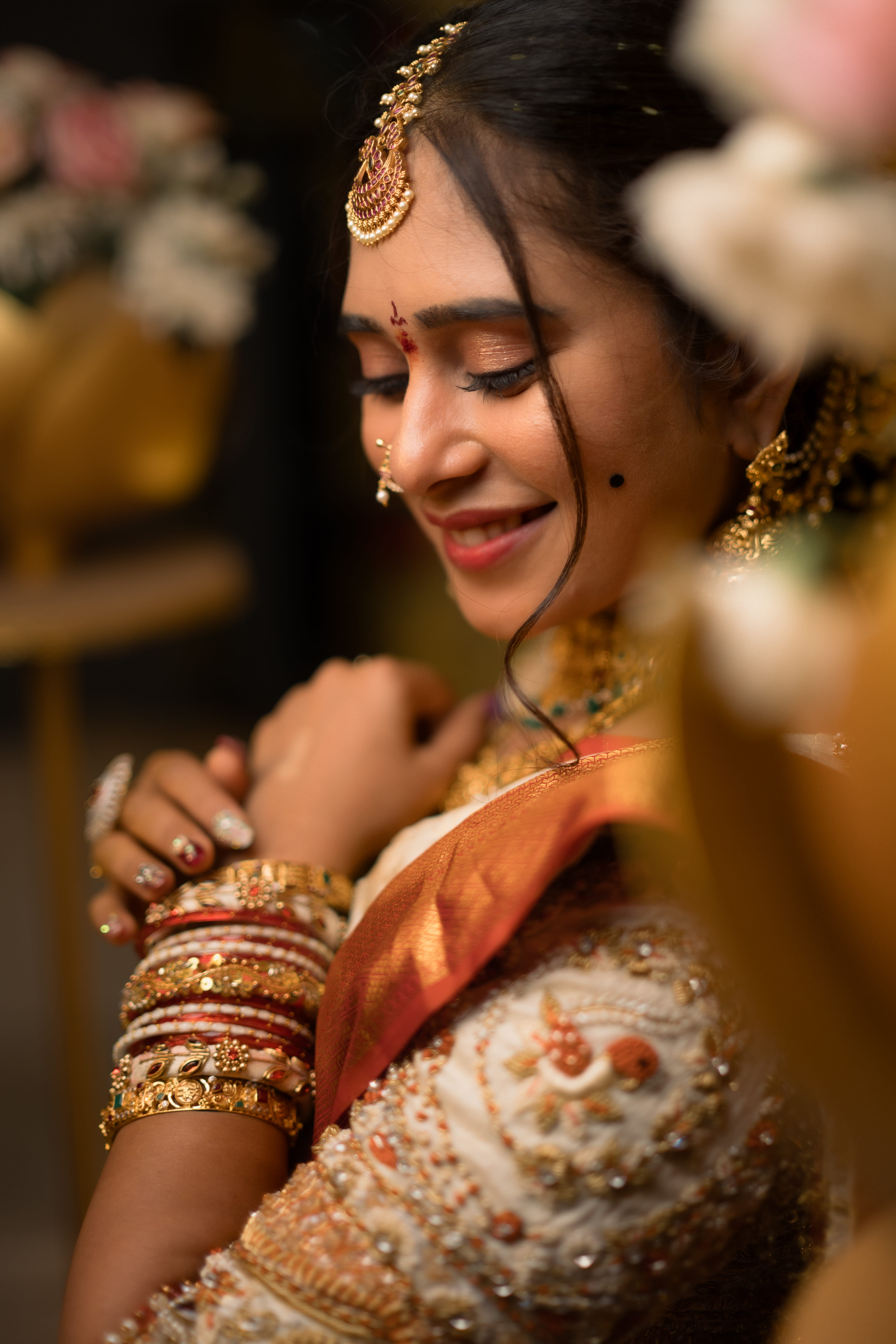 Wedding day photo collage with bride and groom in maroon and gold attire, jewelry and ring close-ups, captured by Wow Makers in Hyderabad, India.