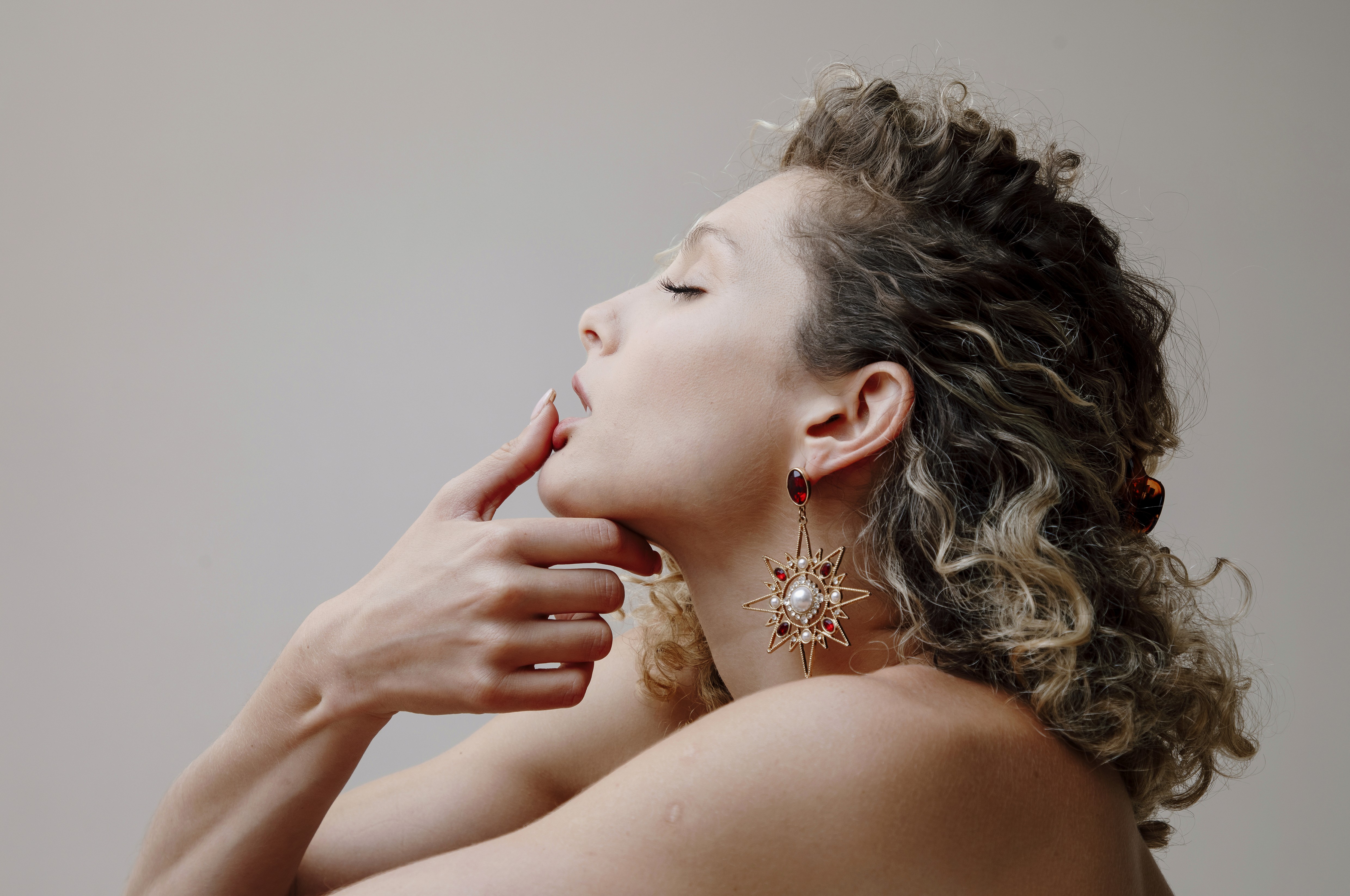 A fast black sports car races down the highway.