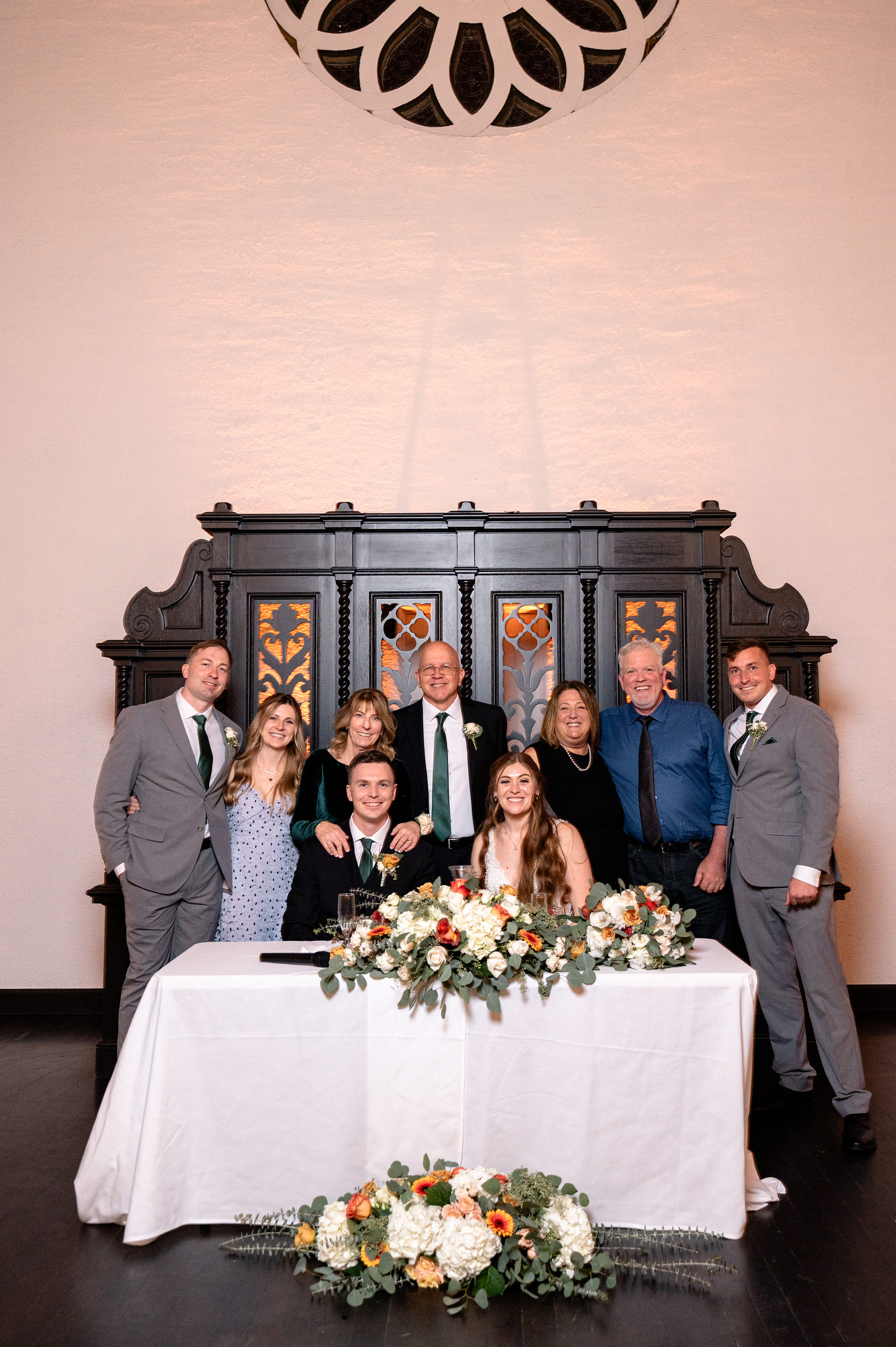 Flat lay wedding details with bouquet, rings, and sparkling bridal heels