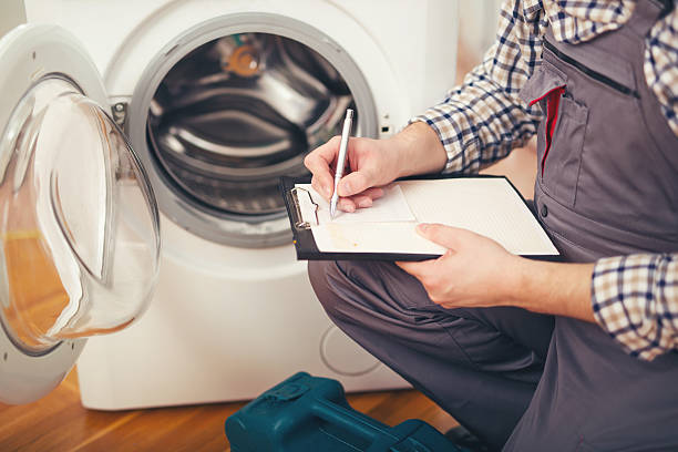 man fixing washer in a house in philadelphia