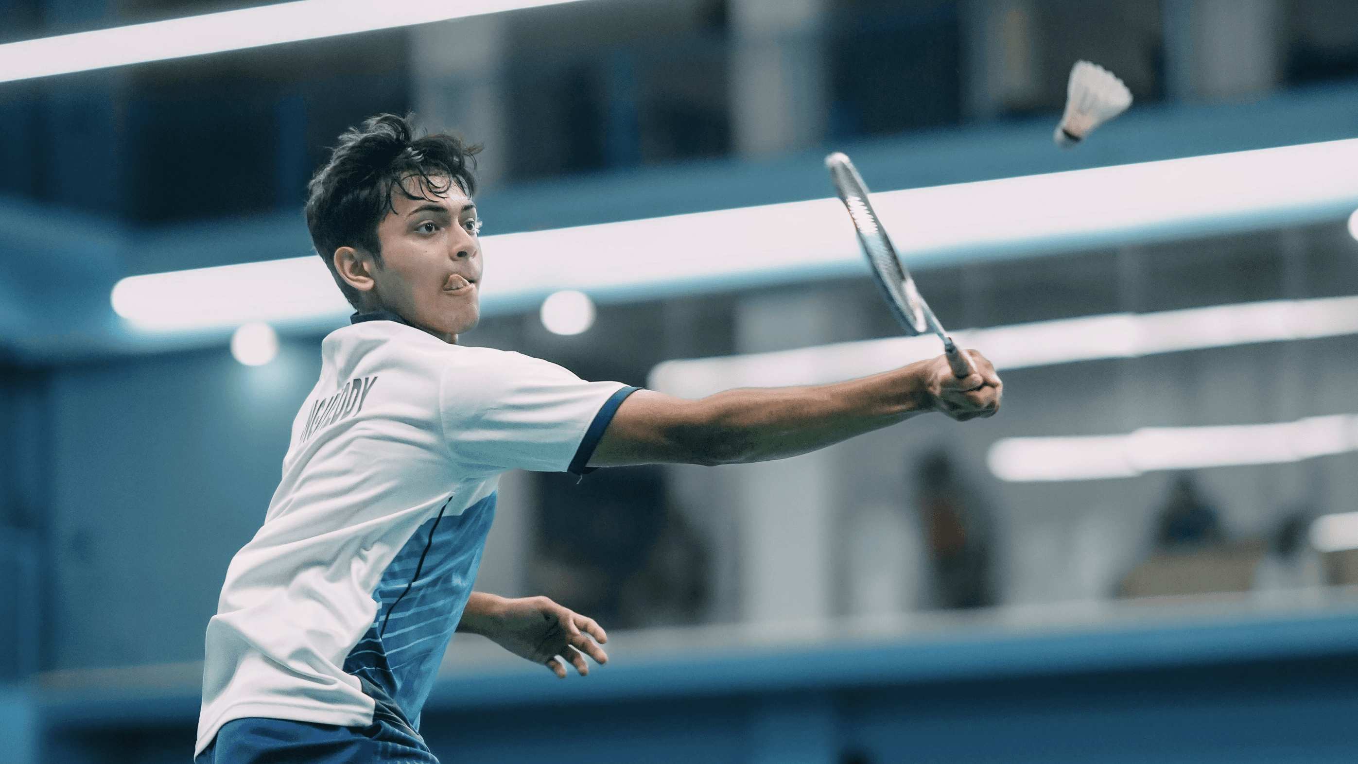 Boy playing badminton