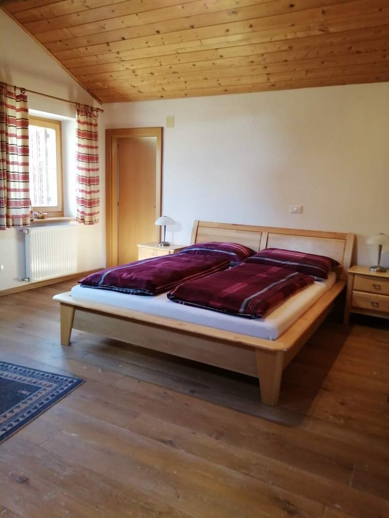 Double bed in the master bedroom of the apartment