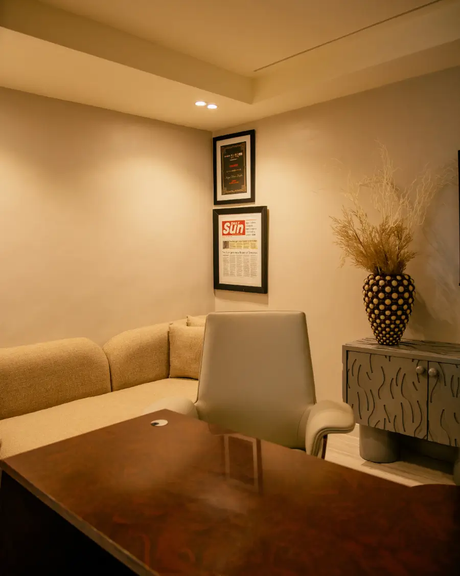 A living room with a couch, coffee table and television
