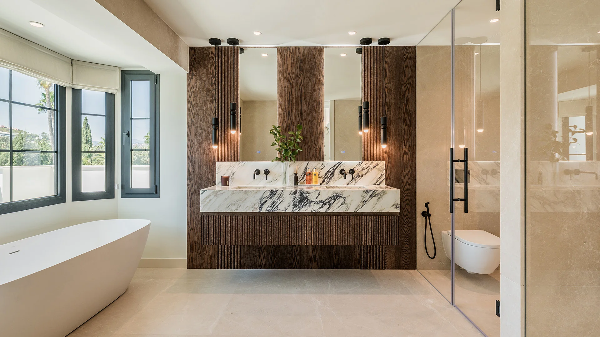 Man in cowboy hat and sunglasses poses outdoors