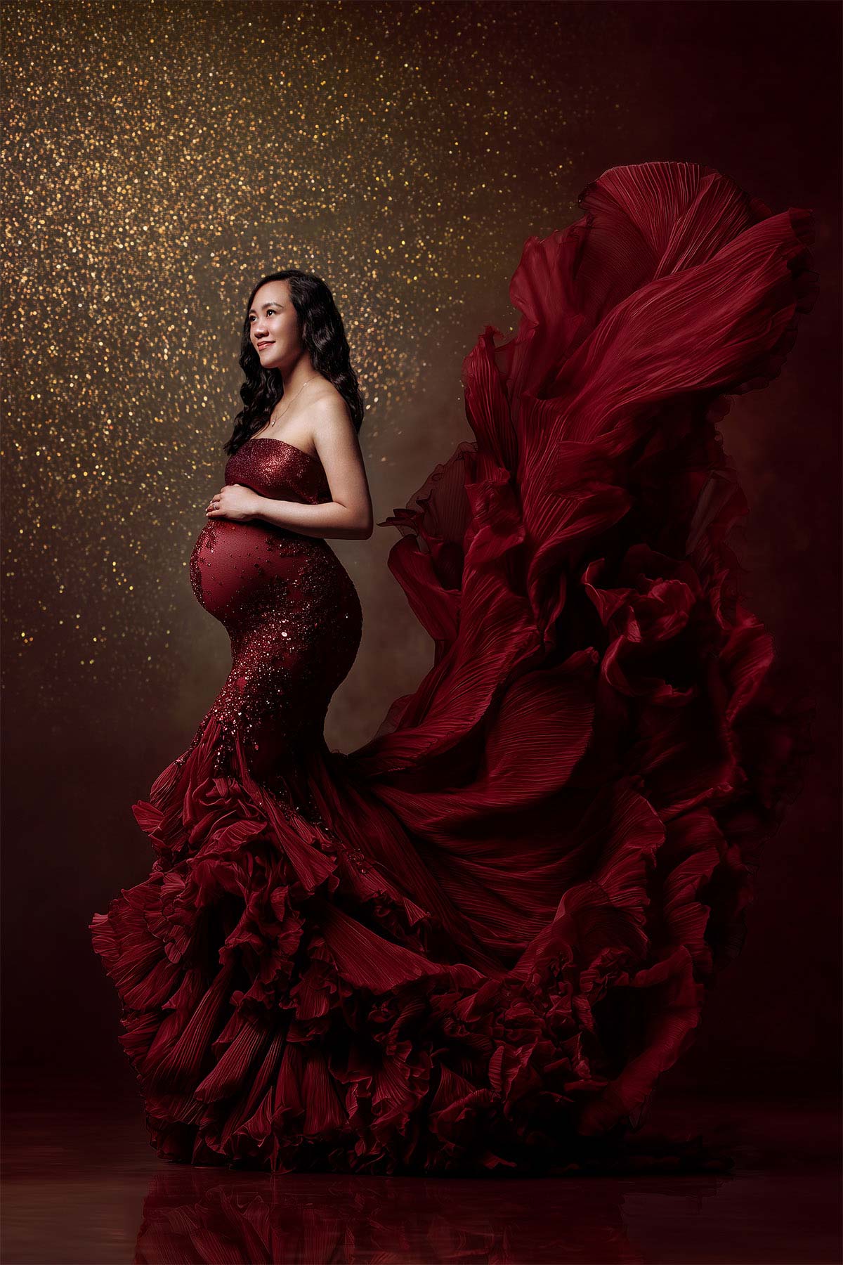 Fine art maternity photo with soft light and graceful posing.