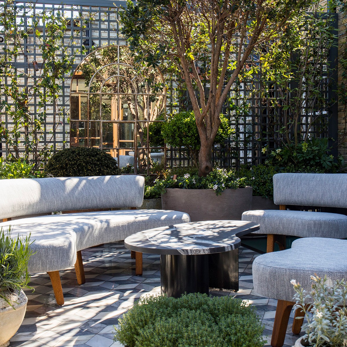 Looking up at a grand domed ceiling with columns