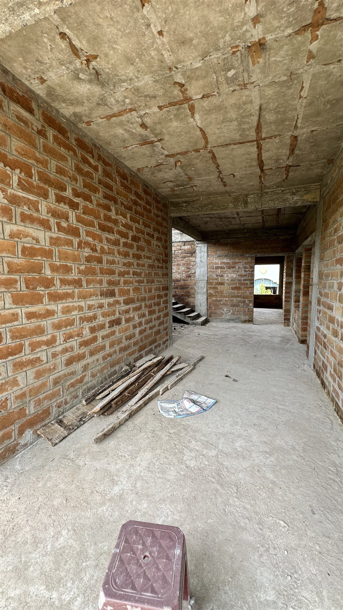Corridor on an upper floor lined with exposed Agrocrete® block walls