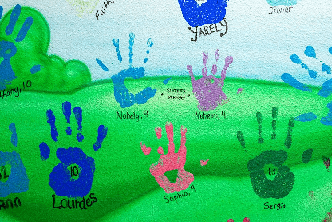 The vibrant interiors of Estrella's House, the CACHSC's Edinburg location. The Child Advocacy Center welcomed its first child in 2001. Since then every child who visits the center has contributed their handprint, name, and age to the walls. With over 22.000 children seen over the last 20 years, wall space is diminishing.