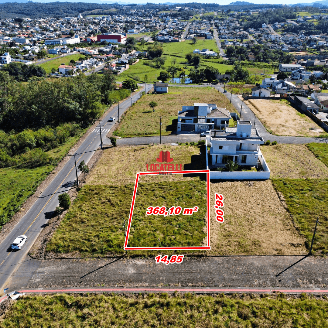 A modern brick house with a two-car garage, well-manicured lawn, and clear blue sky in the background.