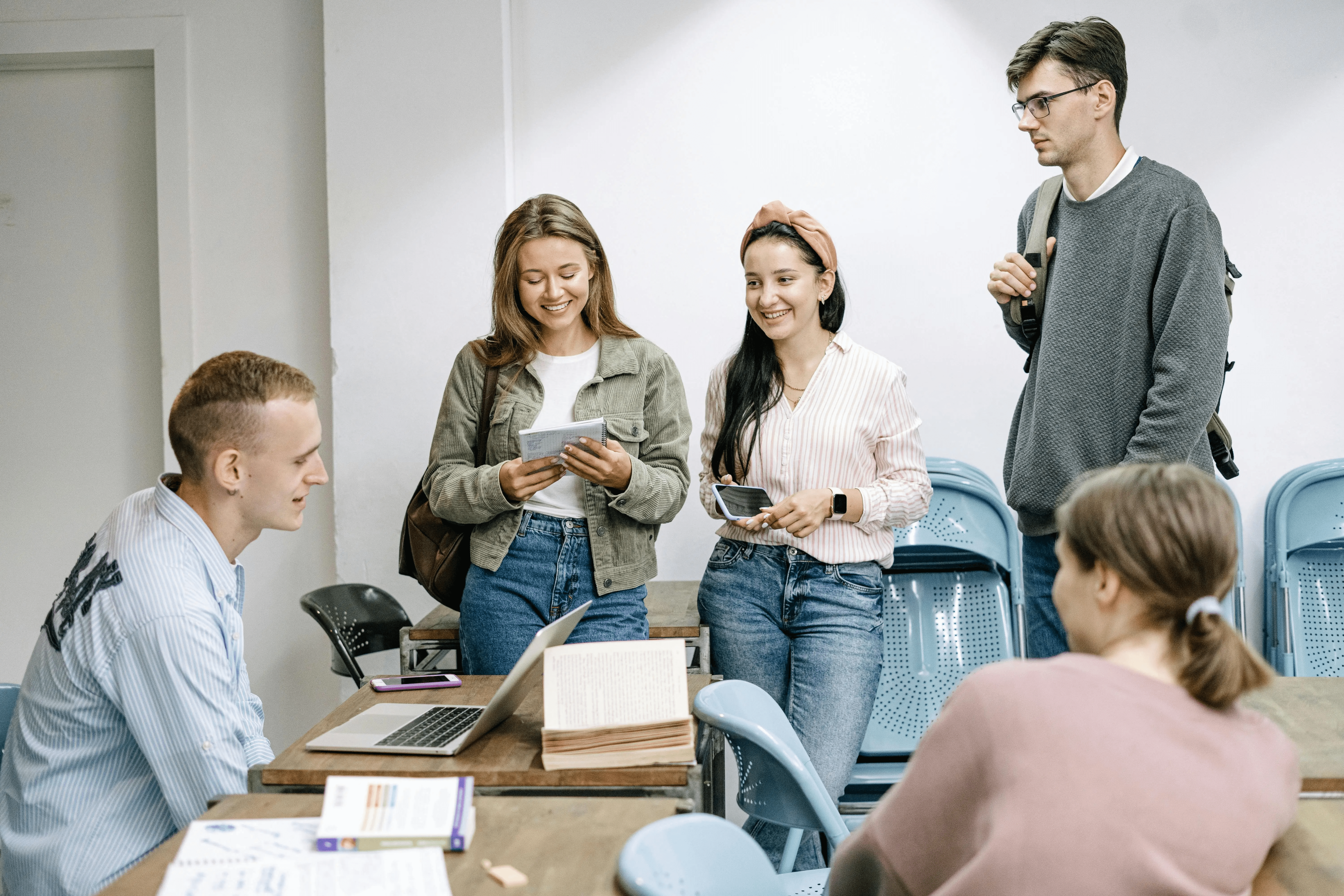 High school student meeting with a university professor research mentor in an academic office
