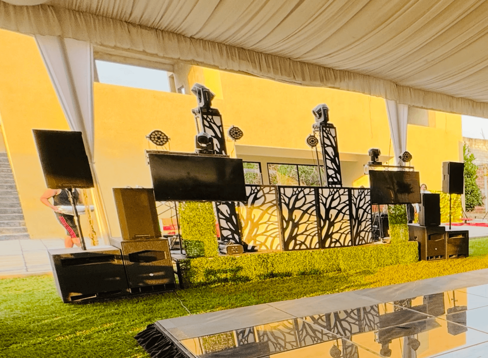 A group of people praticing yoga on the beach in the morning