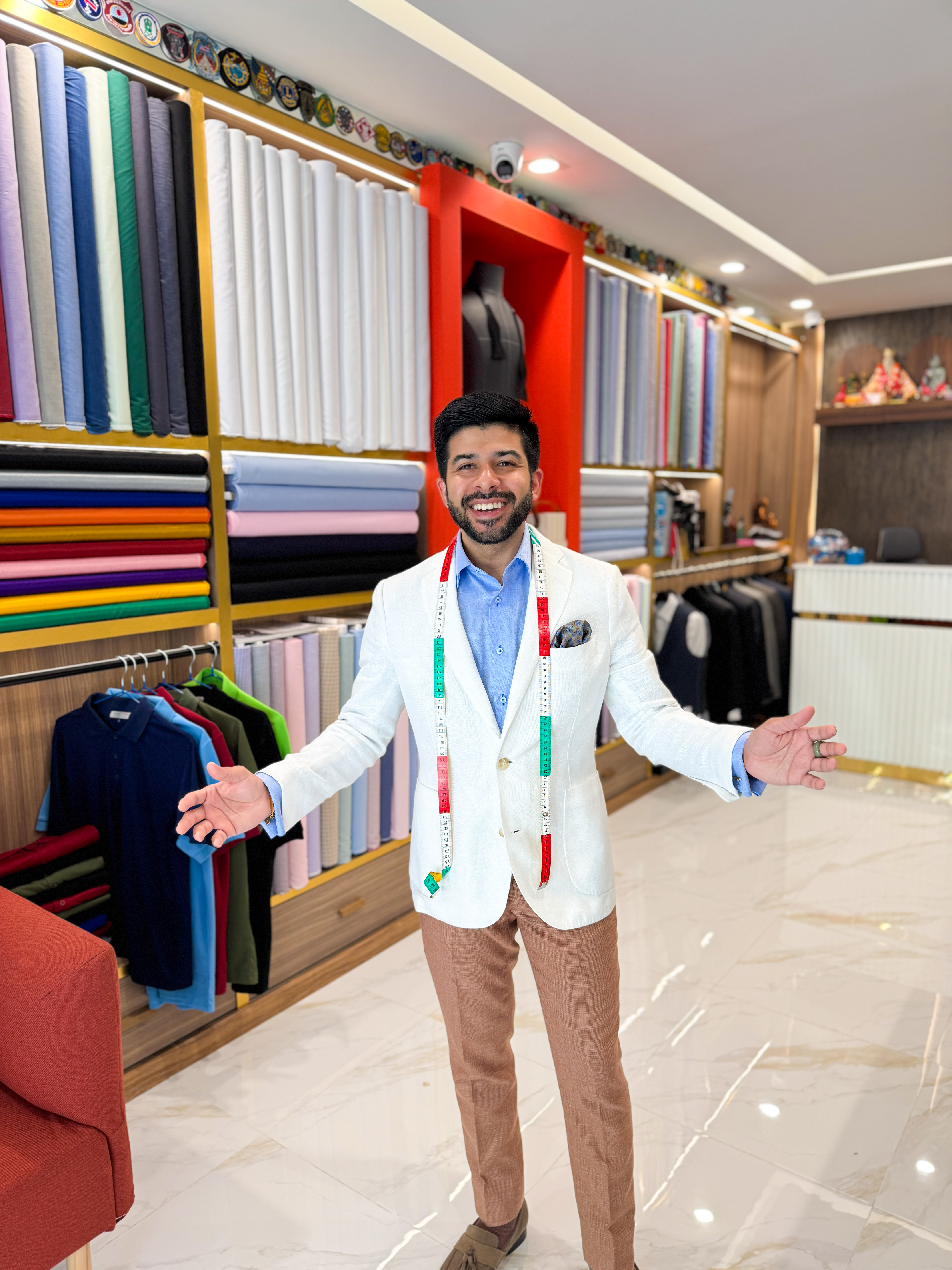 a man in a suit sitting in a chair