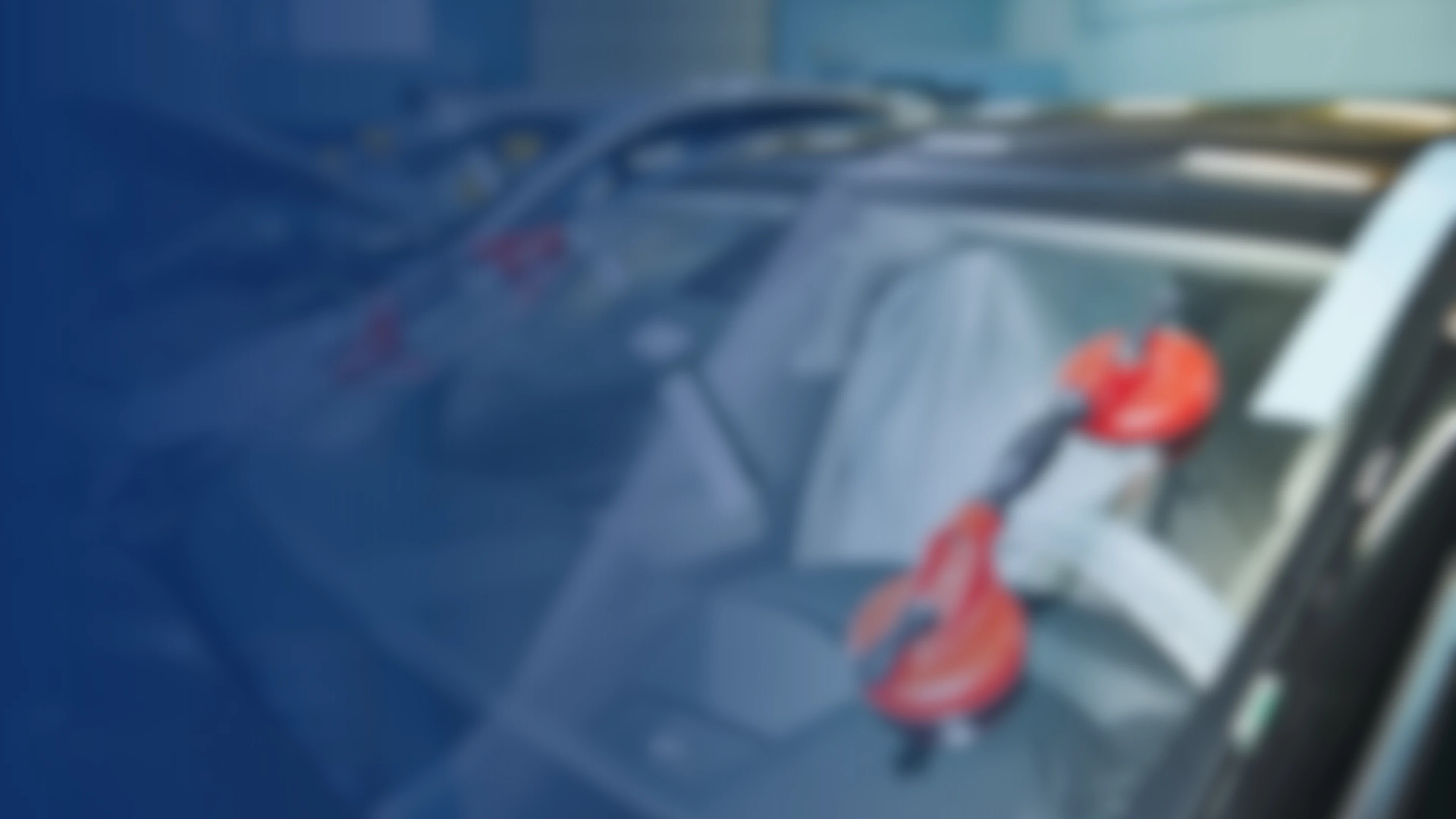 Close-up of a damaged vehicle windshield, suggesting an auto insurance claim scenario