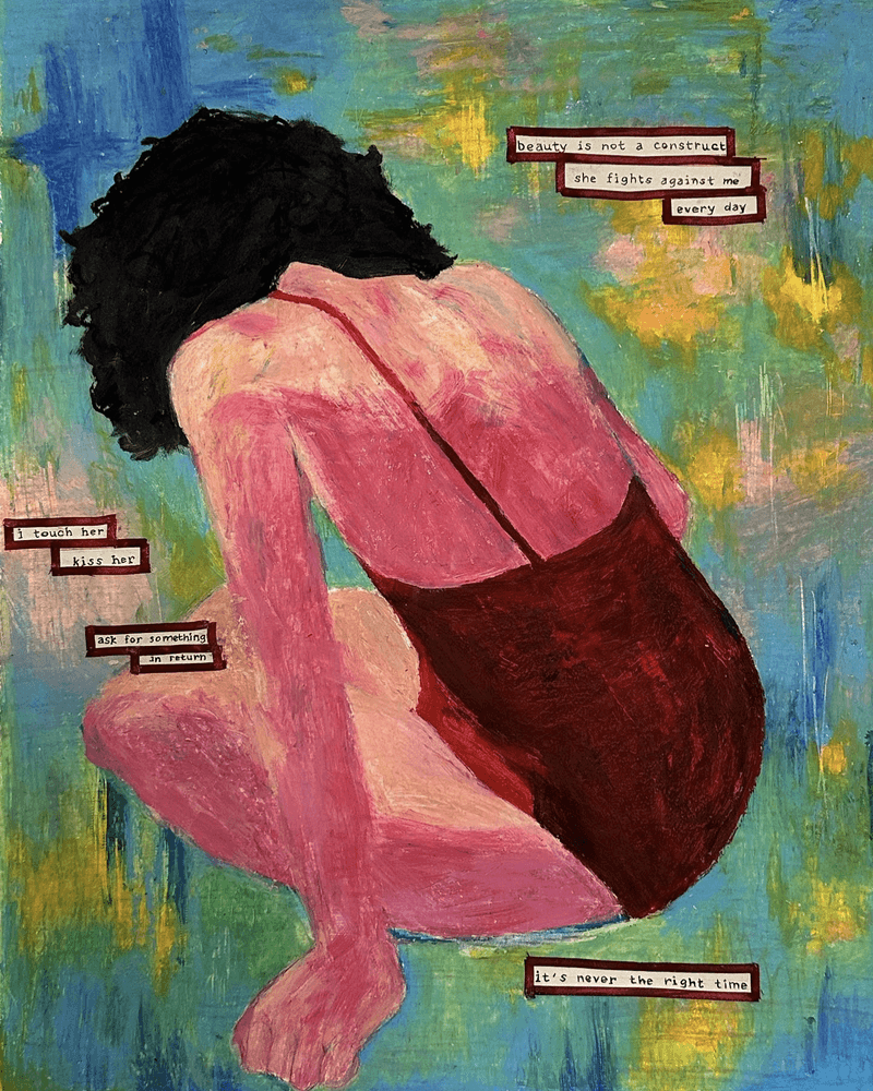 A close-up of a hand wearing multiple decorative rings against a blue background.