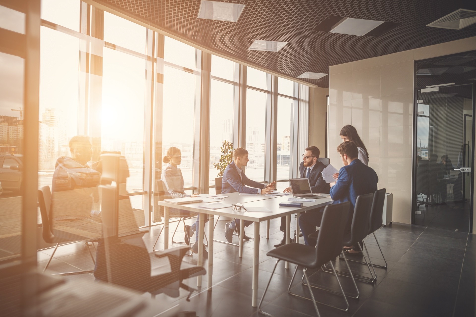 A professional team in a modern conference room, symbolizing the dedication and collaboration at the heart of Inway Risk Management’s journey of passion and purpose.