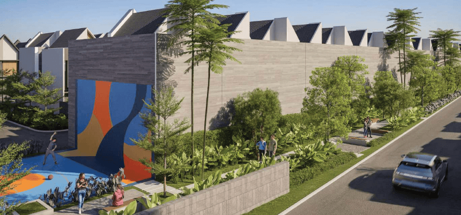 man in orange shirt and black shorts playing basketball