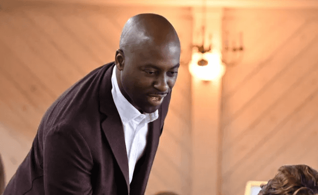 man sitting beside woman looking at a contract on DocuSign