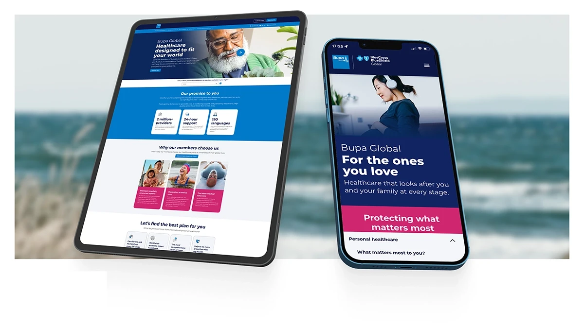 Bupa Global website design displayed on tablet and smartphone mockup against coastal background, showing international health insurance landing page on tablet and BlueCross BlueShield Global mobile site with 'For the ones you love' headline on iPhone