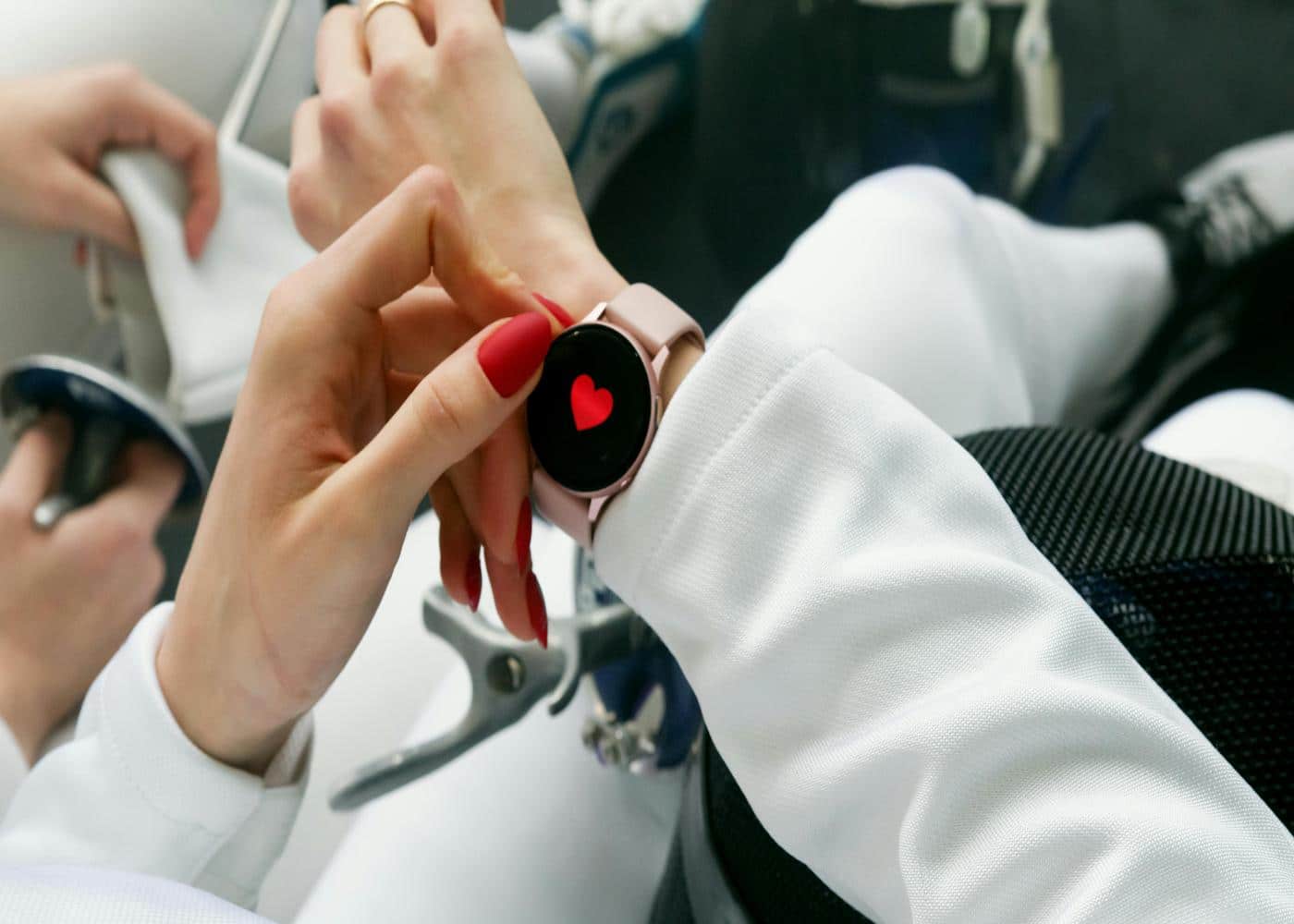 What heart rate zone burns calories? Woman wearing an Apple Watch featuring a heart symbol