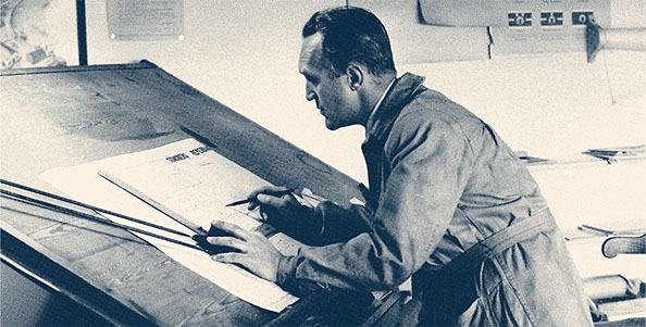 Haltone image of a 1940s designer working at a drawing board - Explore Packages