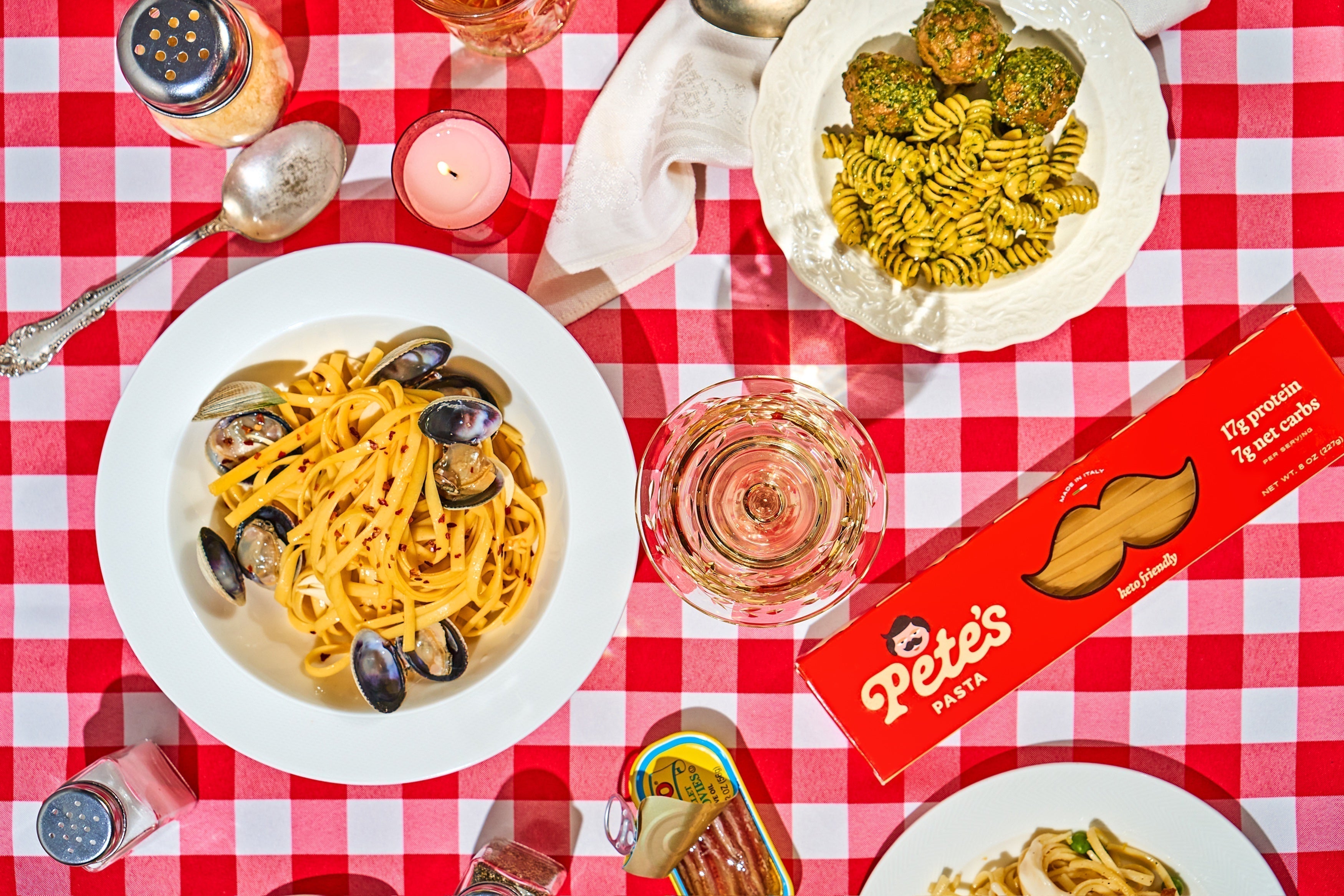 Pete’s Pasta dinner table with wine and prepared dishes