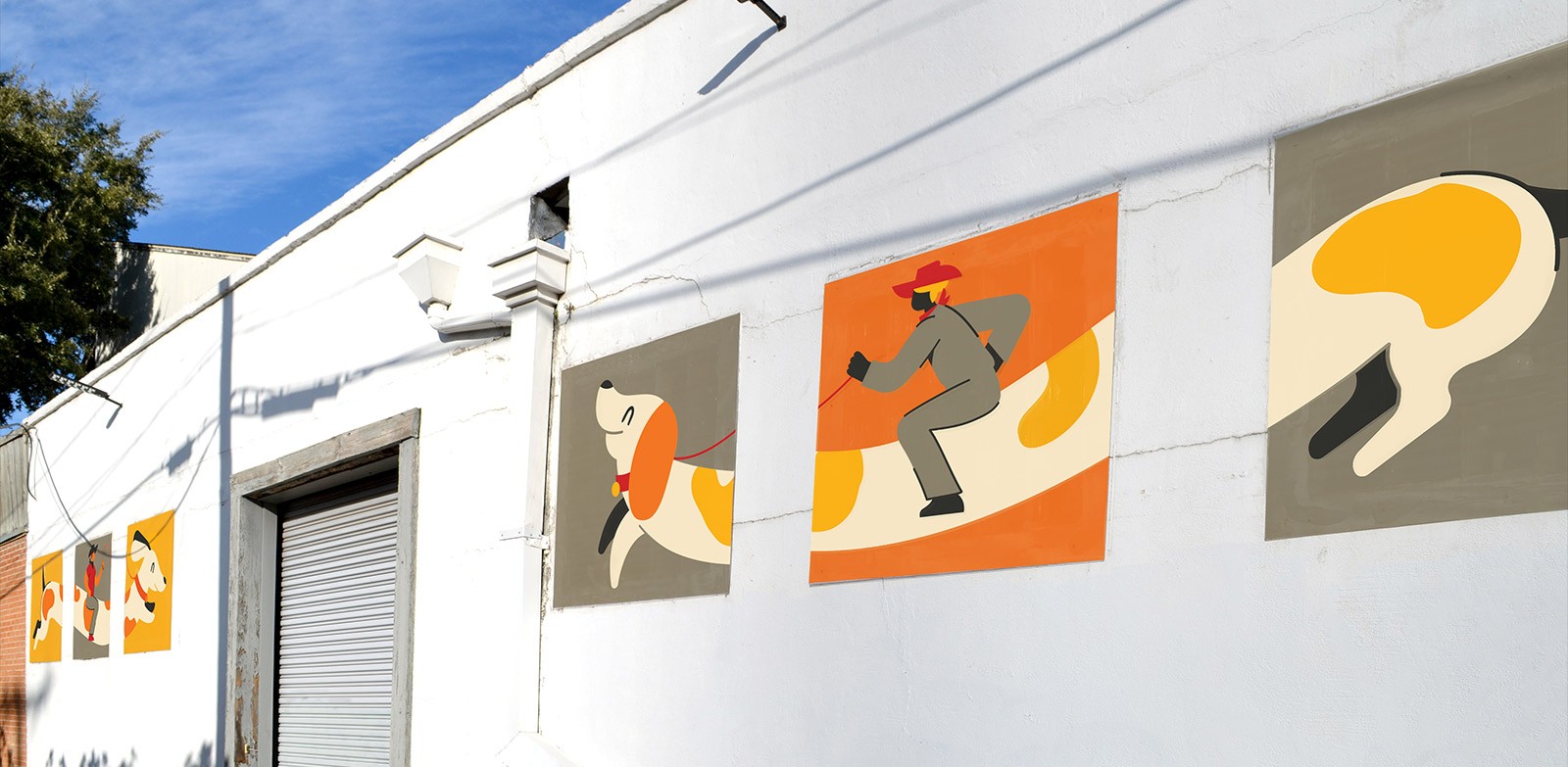 Belmont Exterior Windows covered with posters of cow people riding a weiner dog graphics