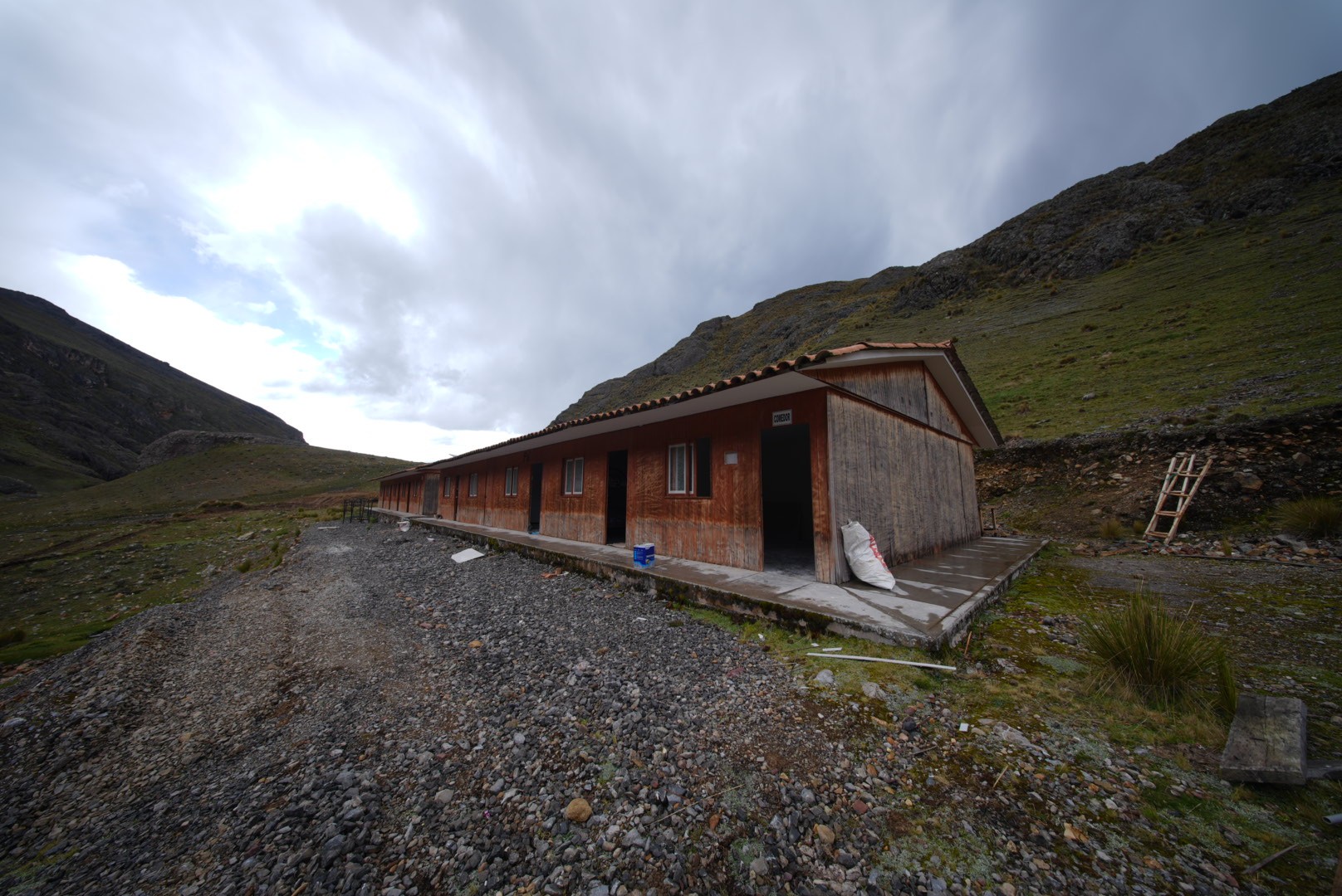a group of people sitting outside of tents