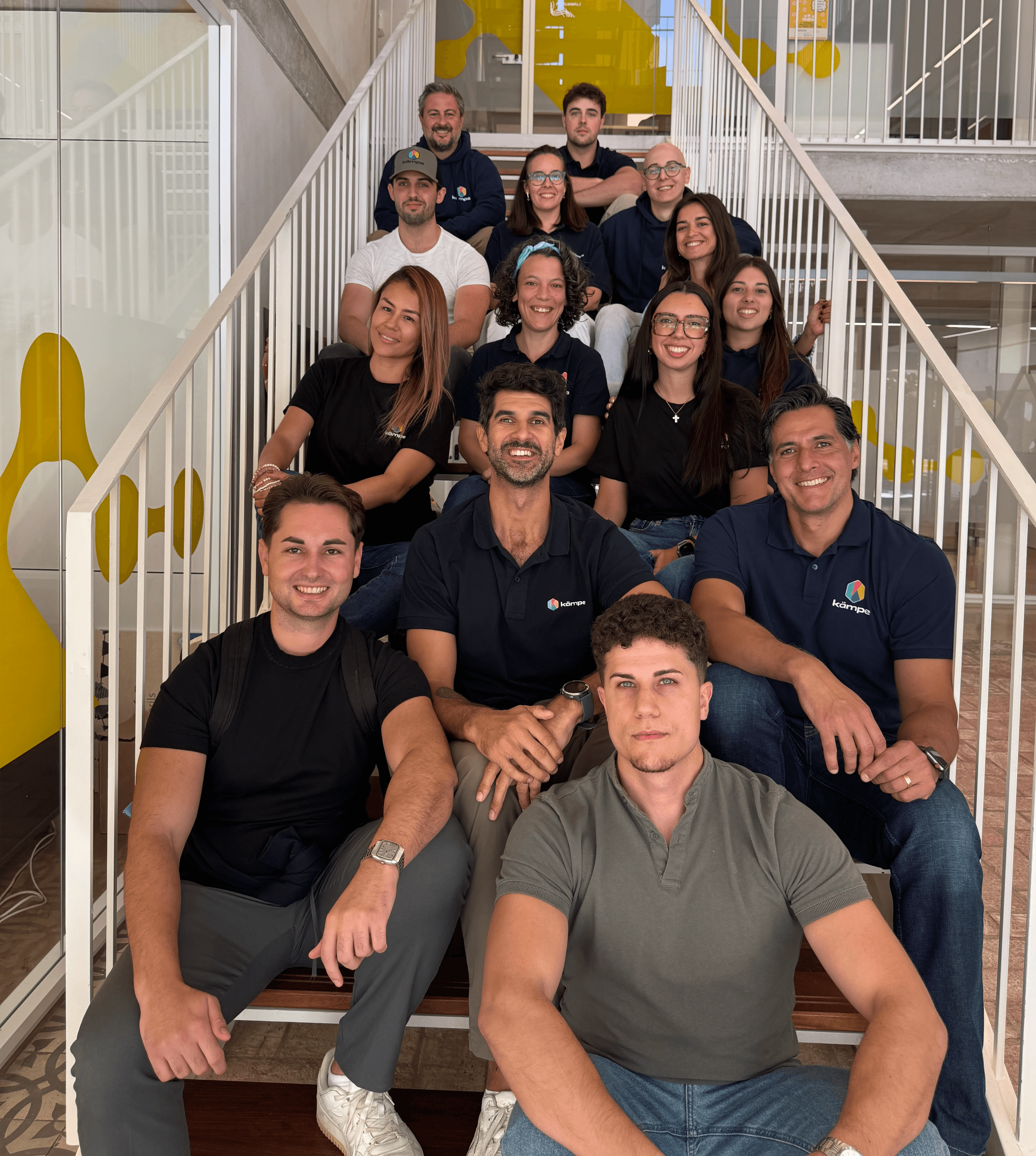 selective focus photography of two men standing side by side wearing green reflective vests