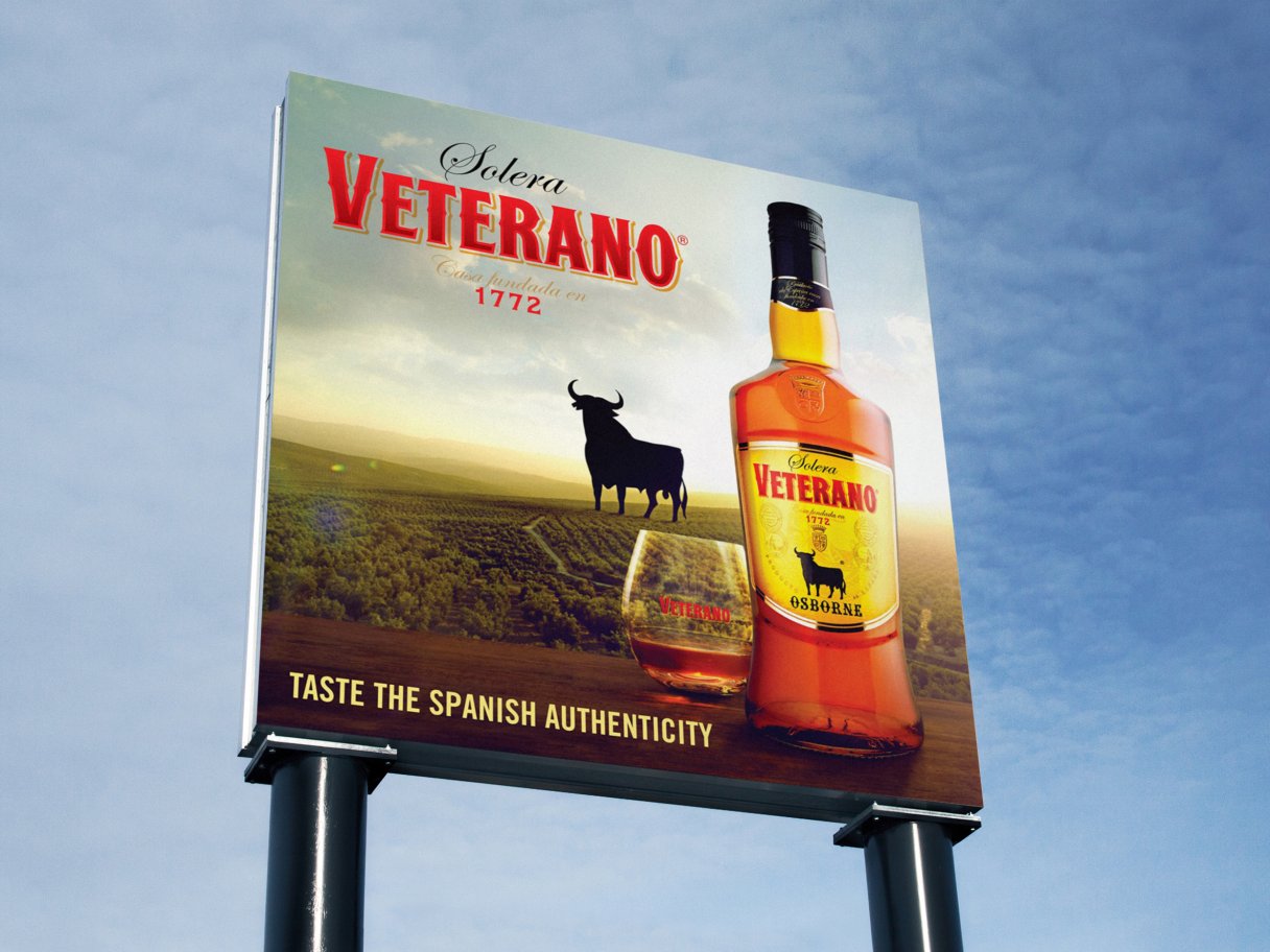 Rooftops of a coastal town with the sea in background