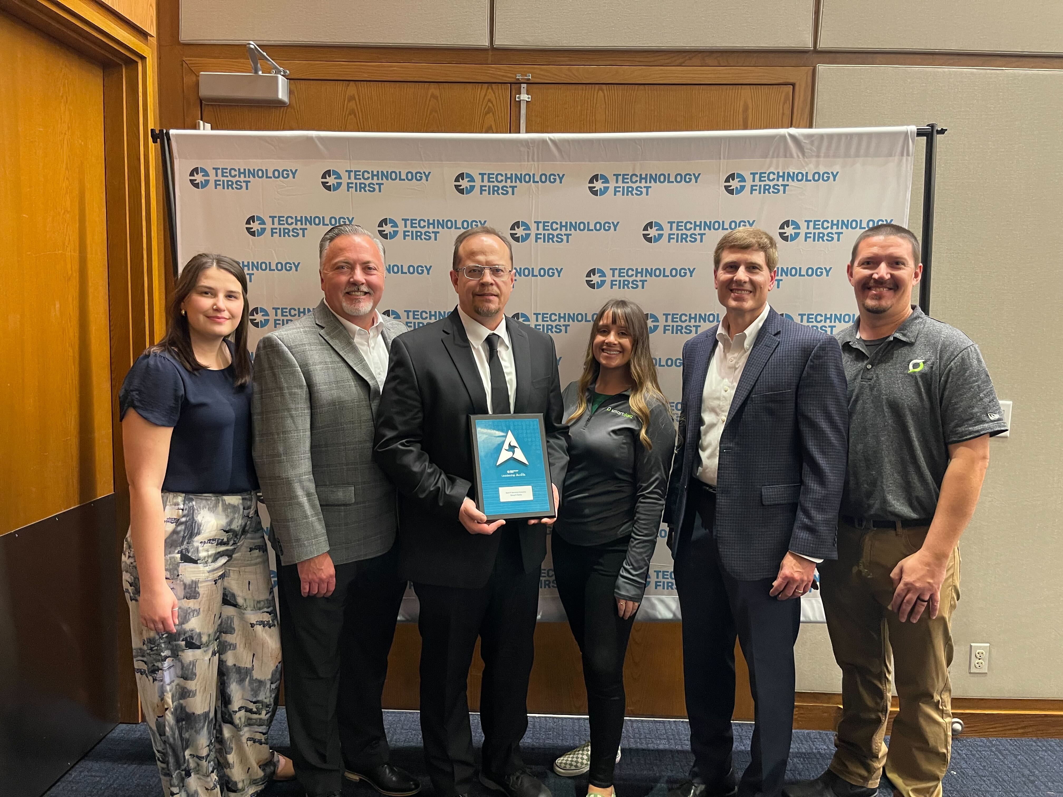 Smart Data Employees at the technolgy first leadership awards holding the Best IT Services Company Award