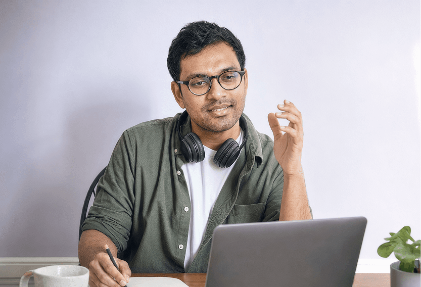 Volunteer tutor taking notes during an online session
