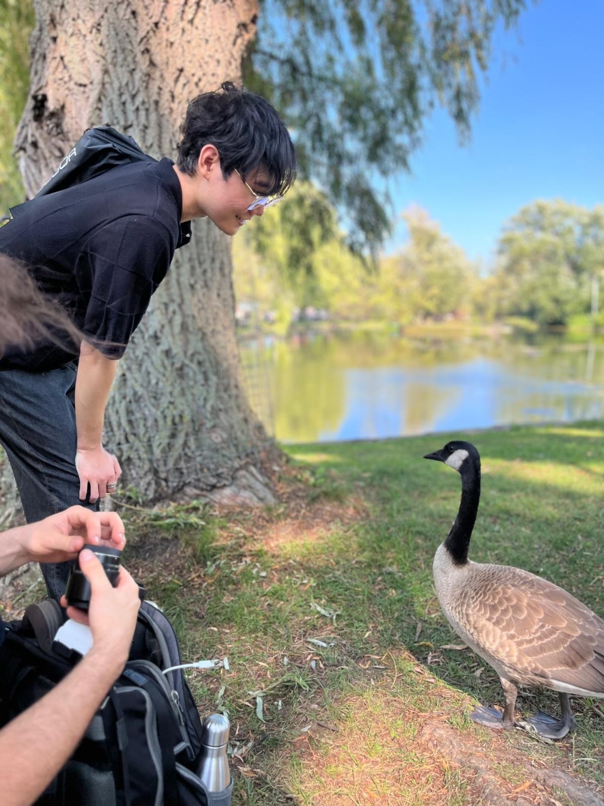 Side shot of a aman wearing a cap with the sun setting in the background