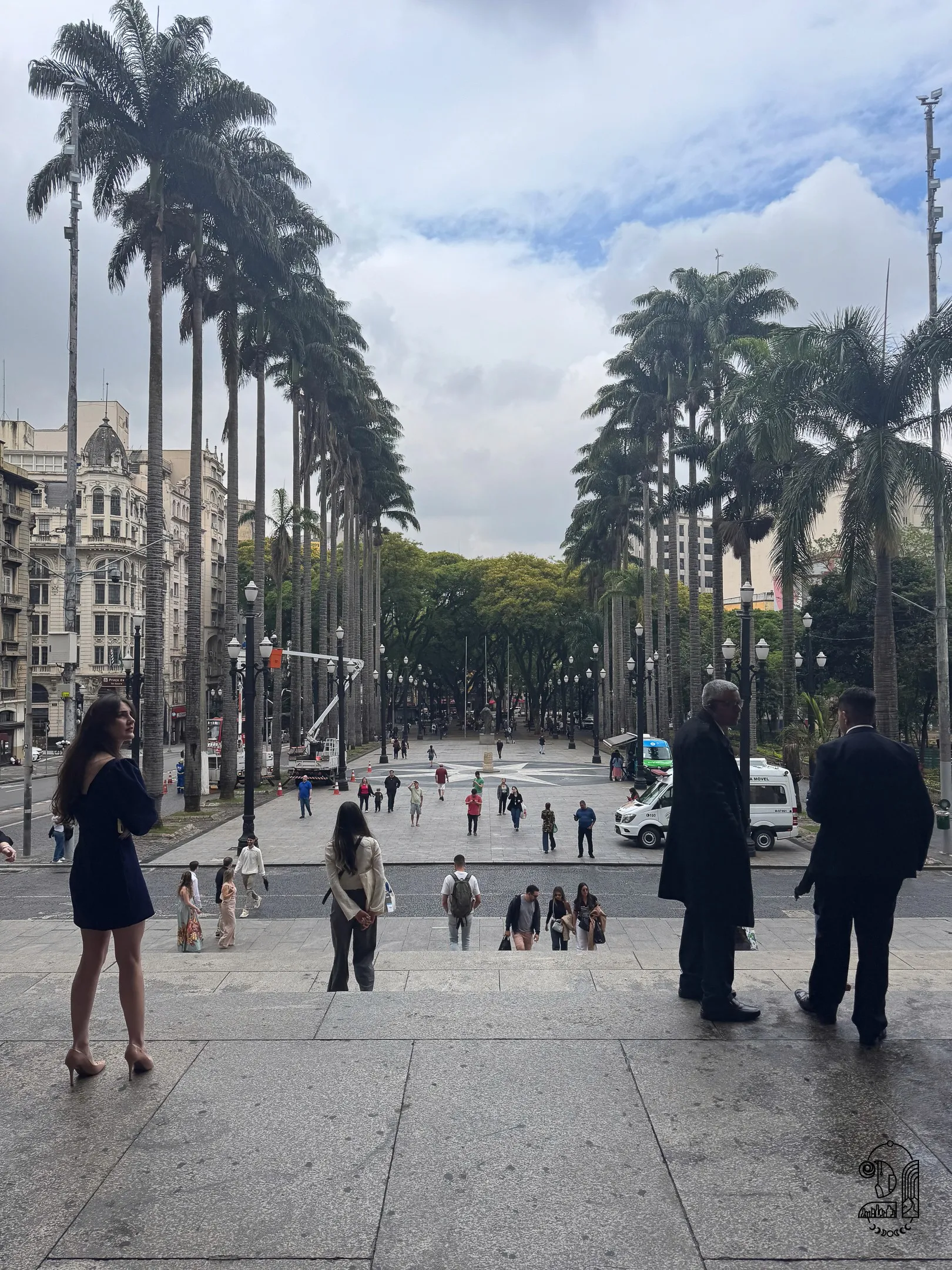 A square with palm trees around it in front of the Cathedral of Sao Paulo