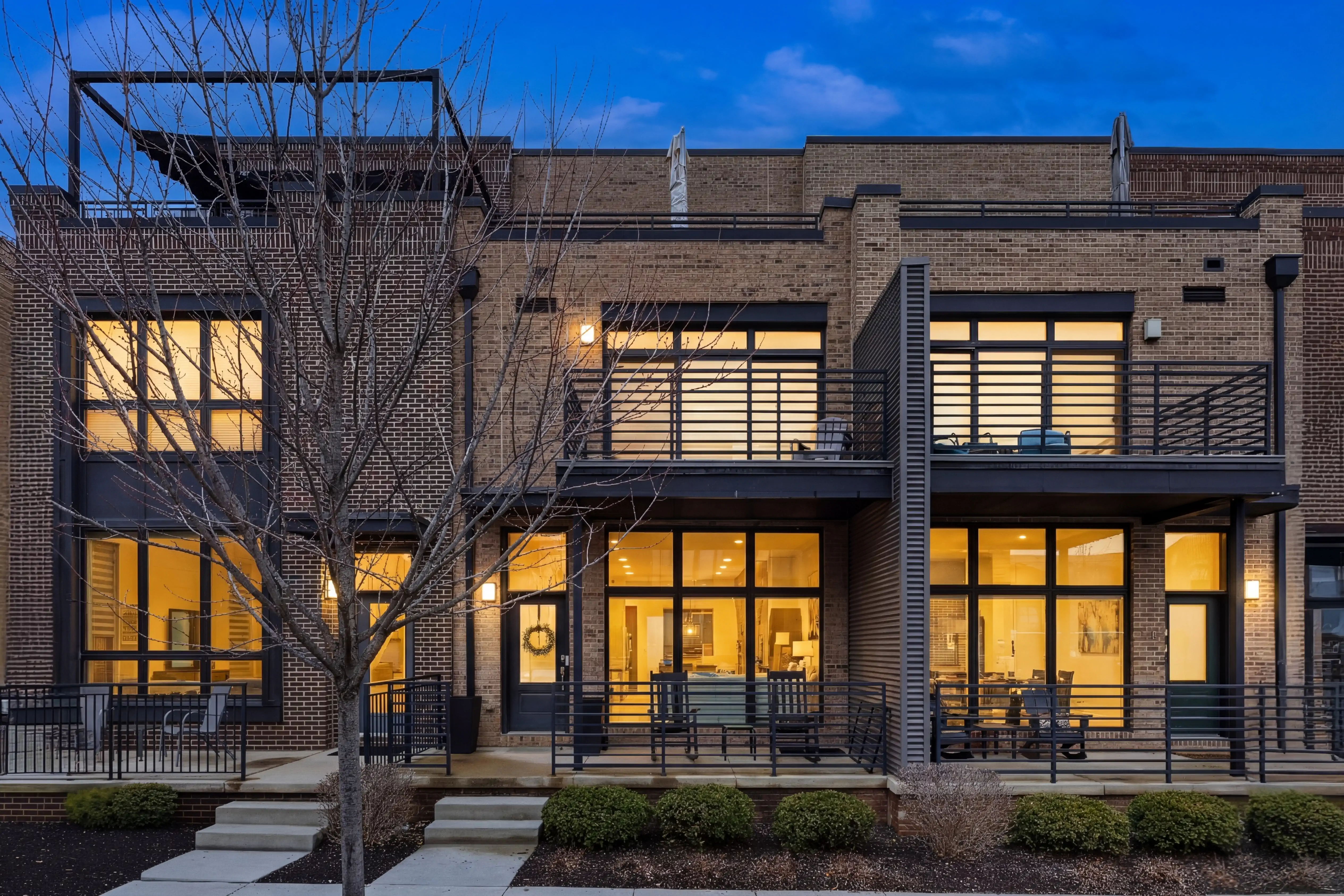 Tightly framed photo of a modern brick home in ohio in the evening