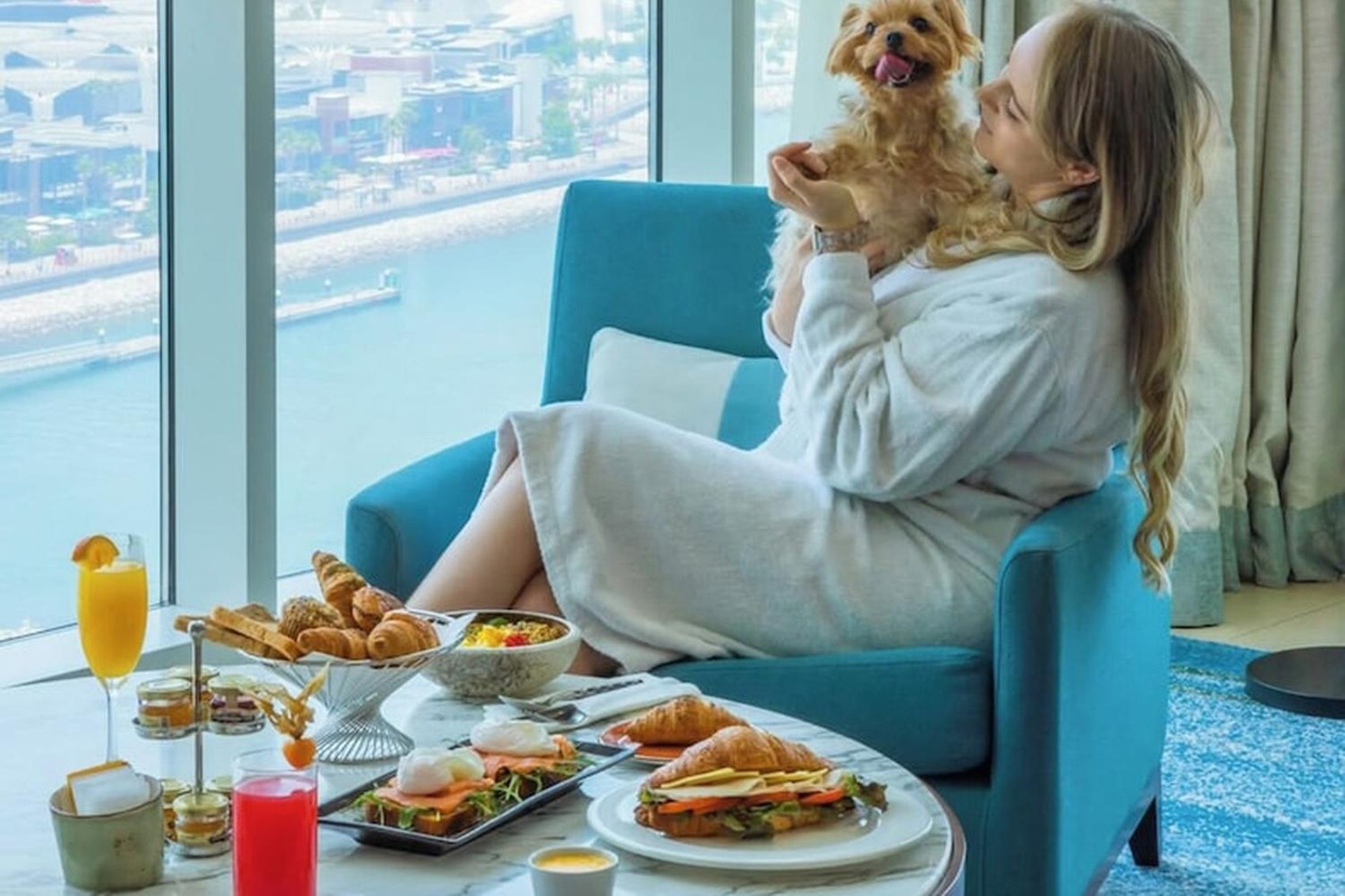 A compact guest room with balcony at DoubleTree by Hilton, a pet-friendly hotel near Dubai Marina