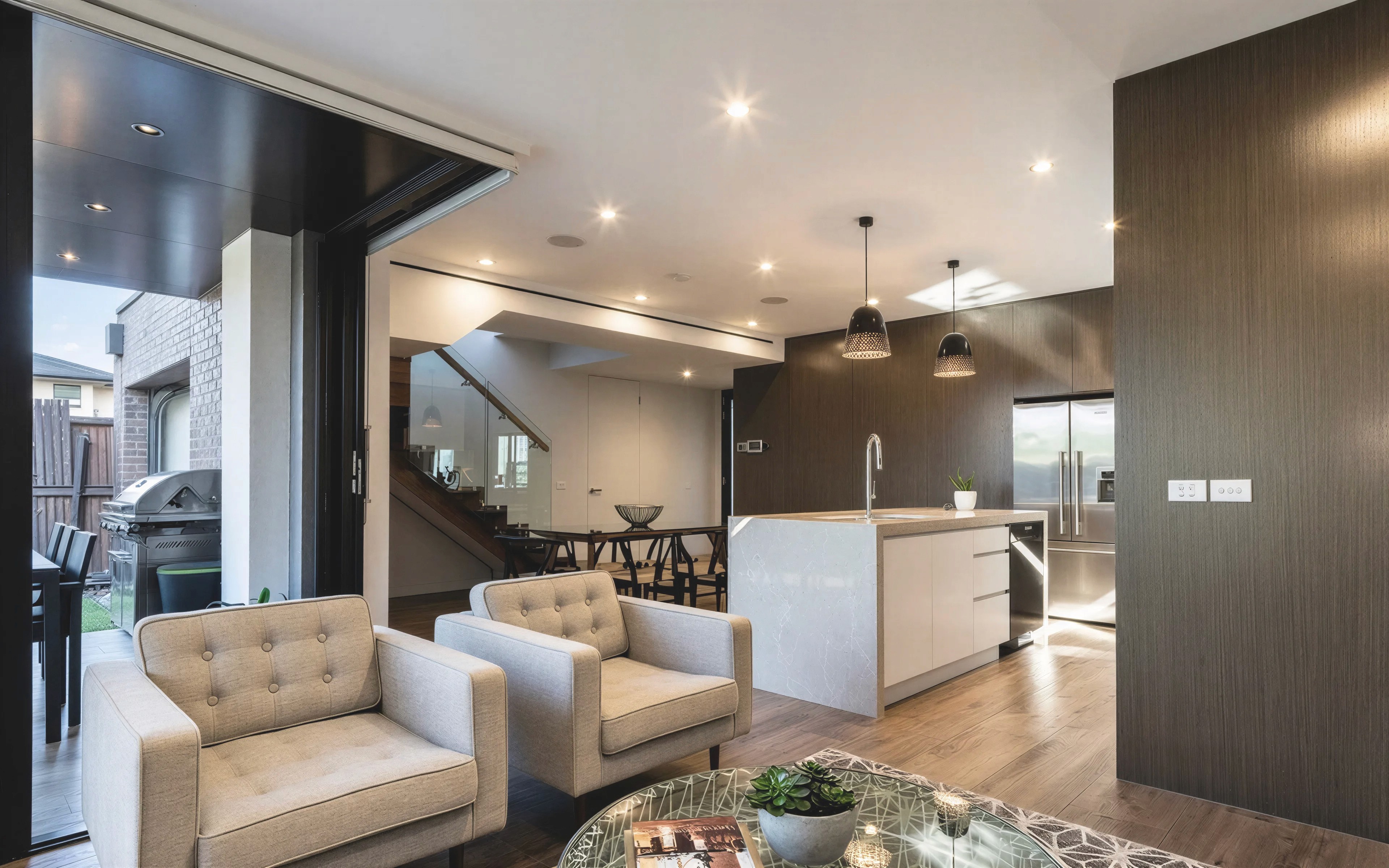 Open-plan living and kitchen interior at Bishop townhouse in Kingsville, Melbourne