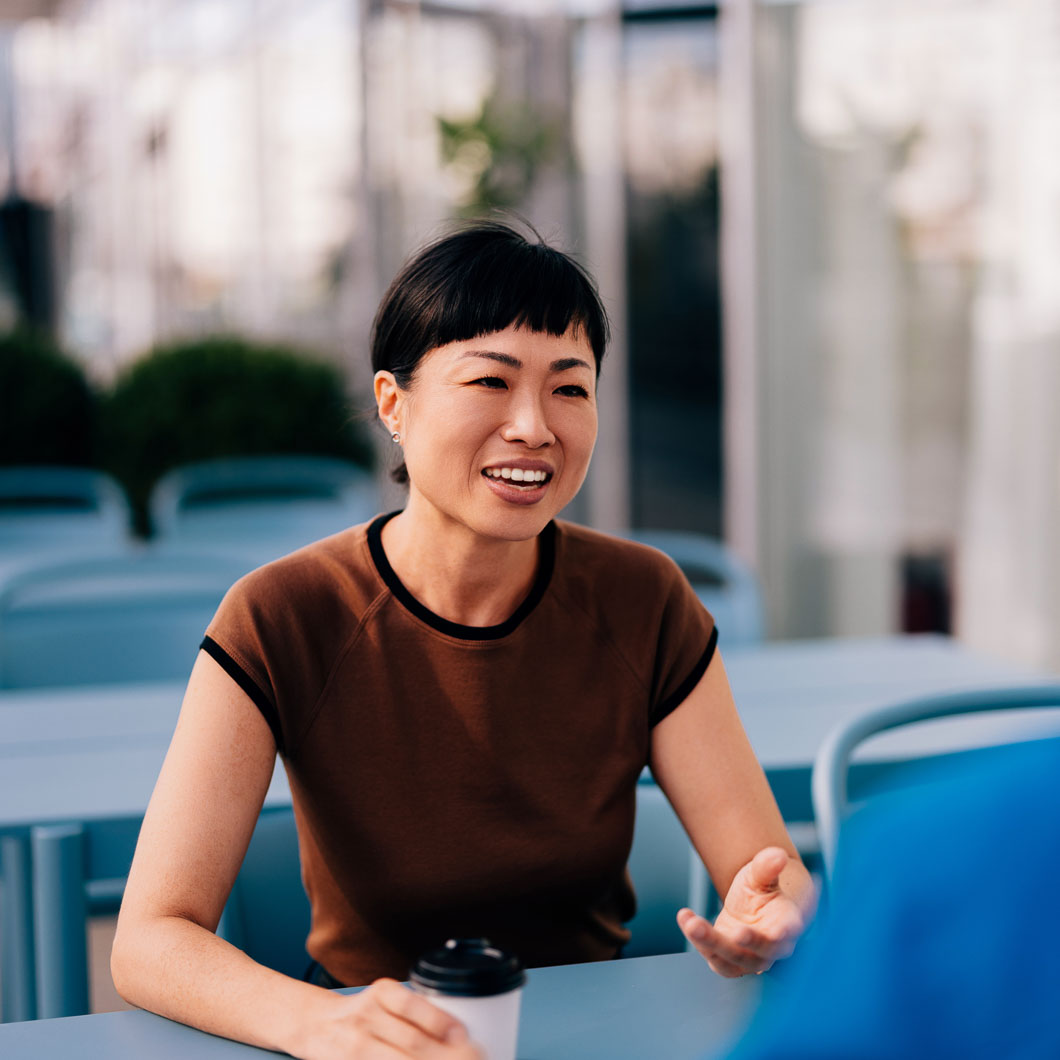 EB-1 visa lawyer speaking with client in office setting
