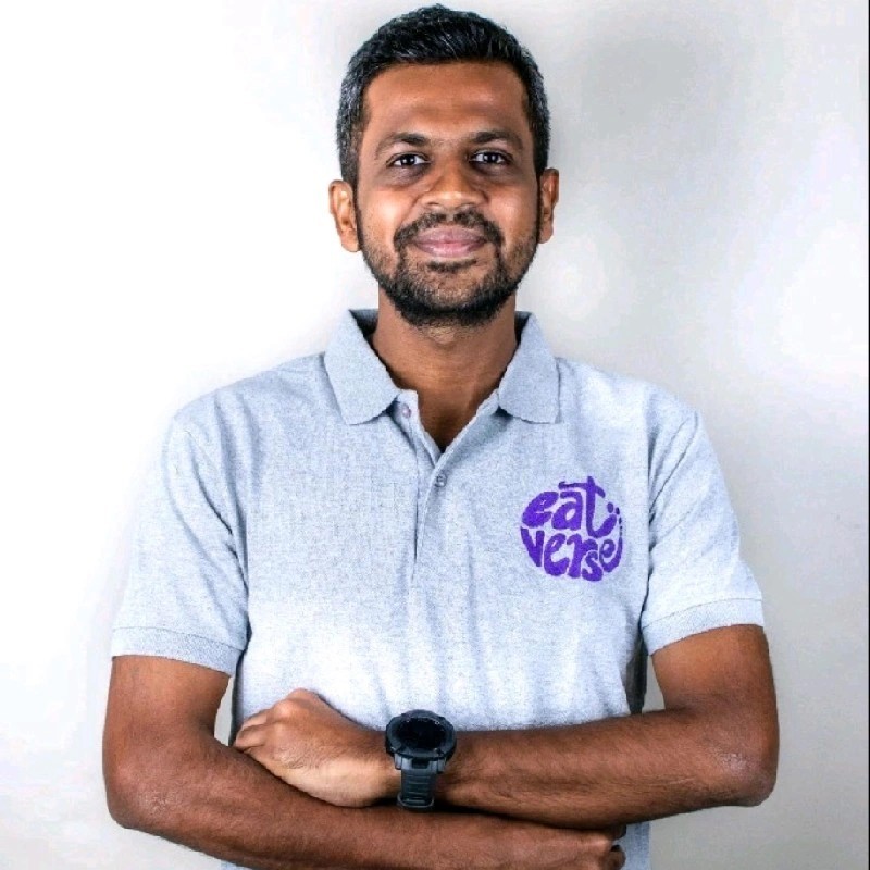 a man in a blue suit posing for a picture