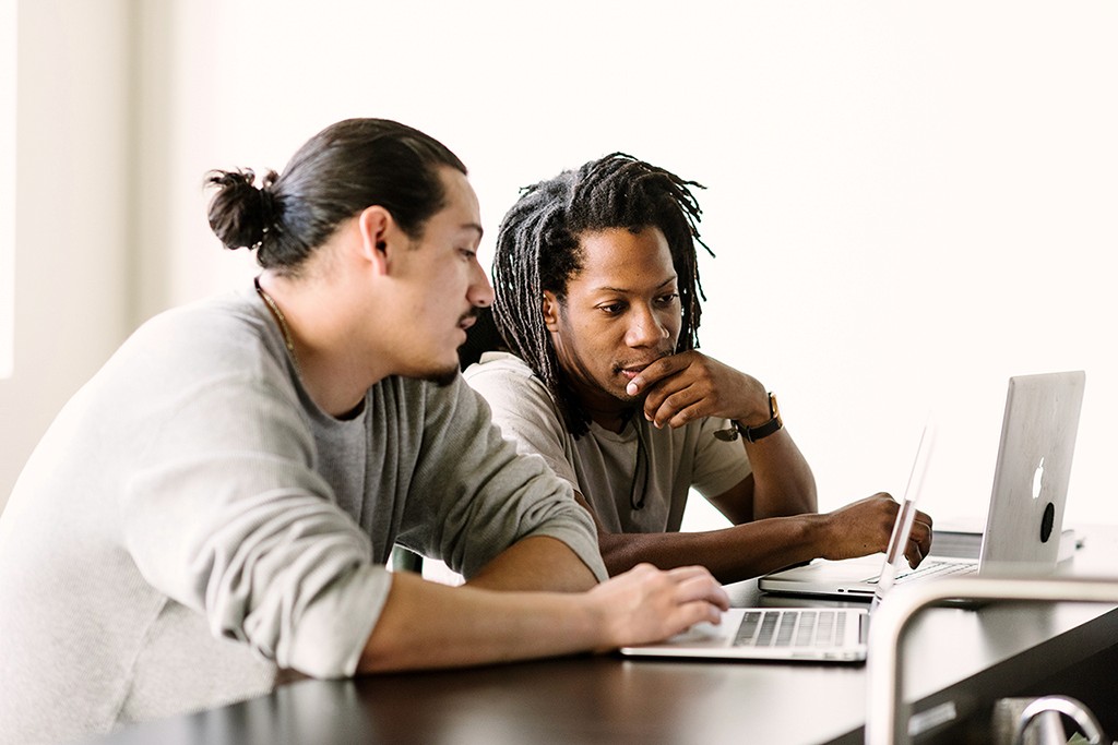 A practitioner collaborating at close range, actively engaged in co-design.