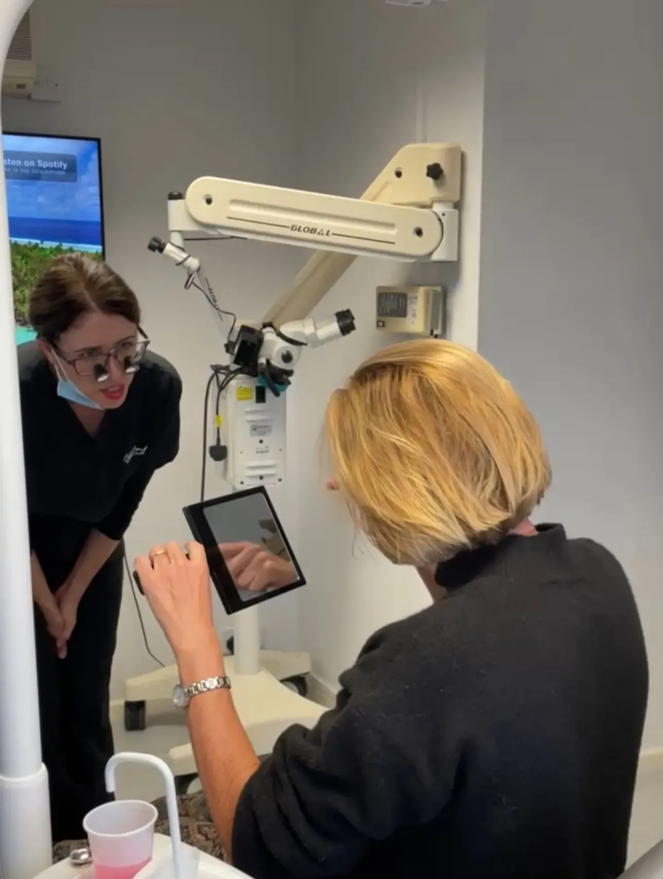Dr April speaking to a patient about their teeth.