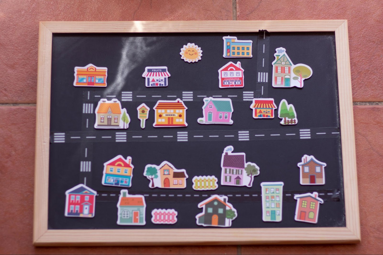 Sign displaying 2D images of commercial and residential real estate