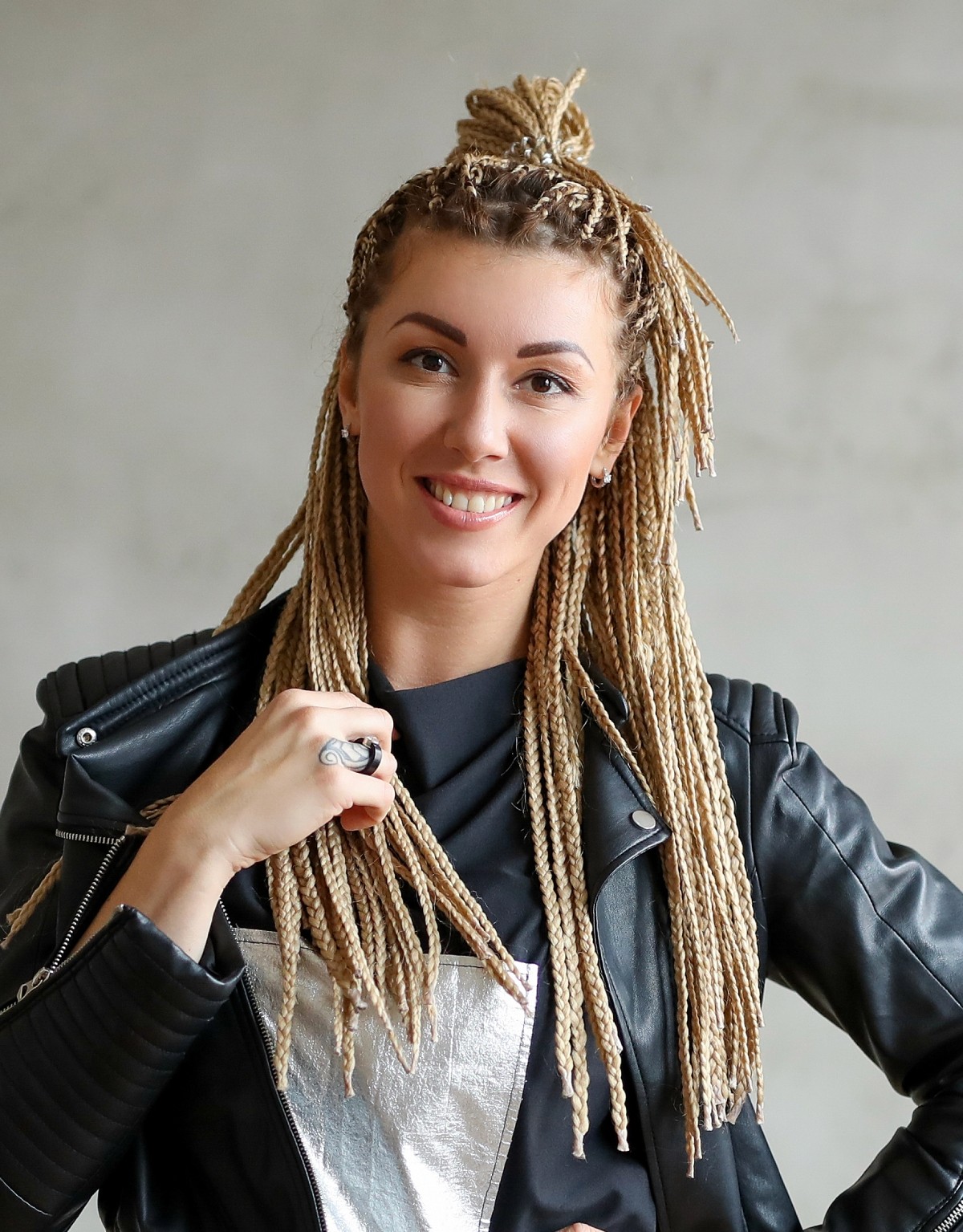 portrait photo of a woman with braids