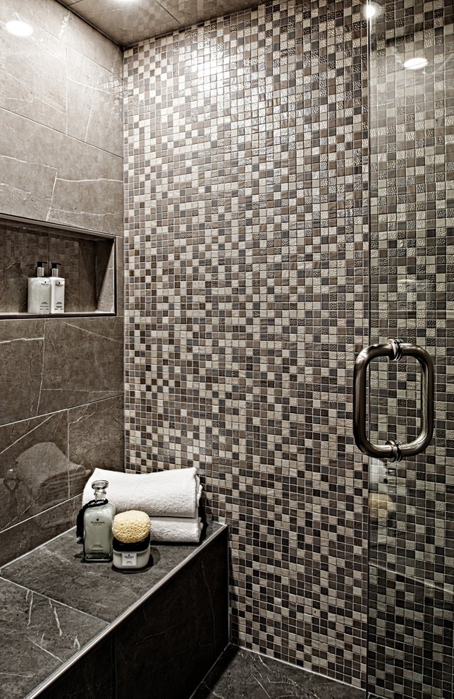 Image of Luxurious bathroom interior with shower, marble tiles, built-in shelf, and spa-like amenities by KHD Homes.