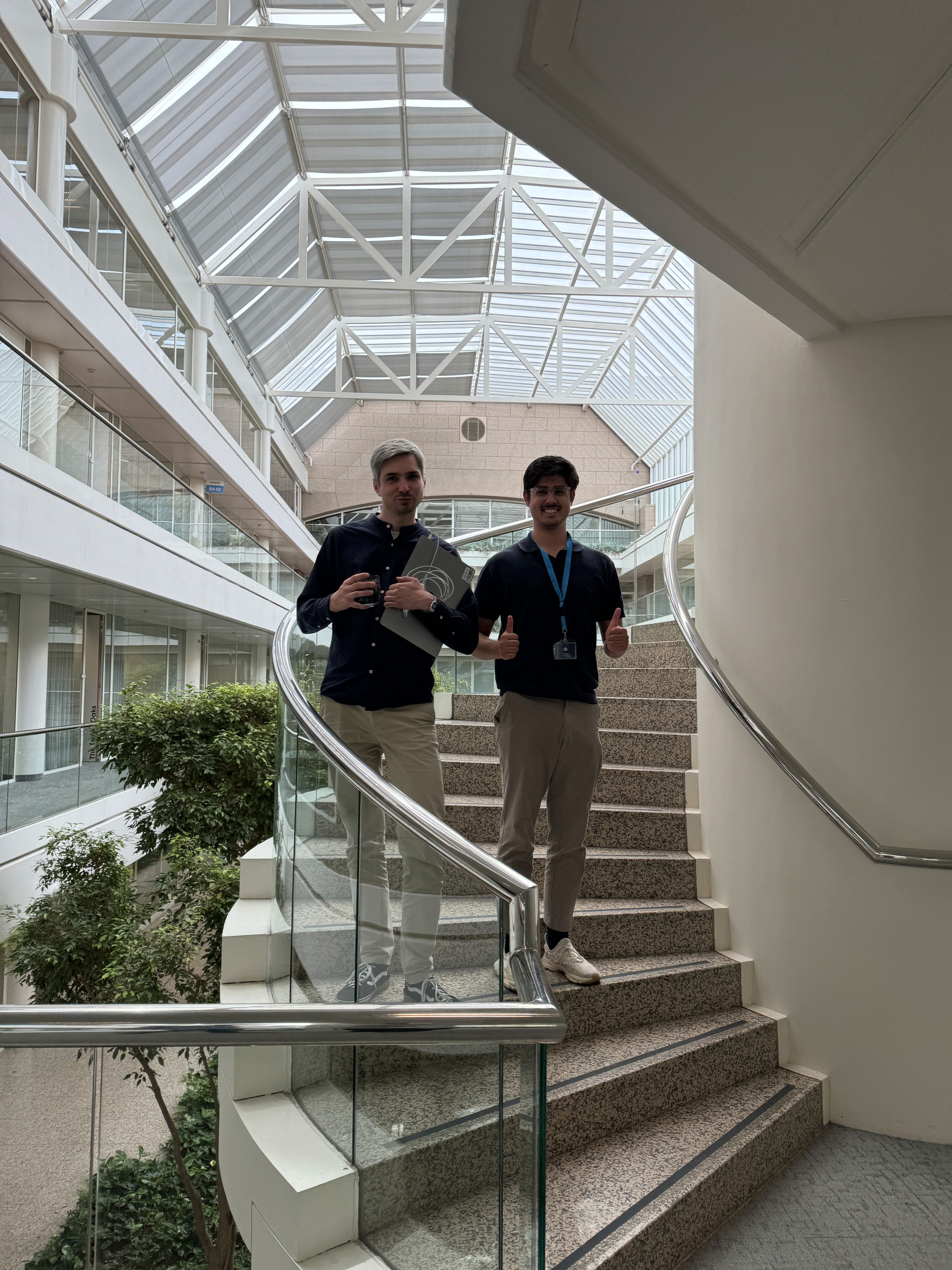 Green car under neon lights in a rainy city street