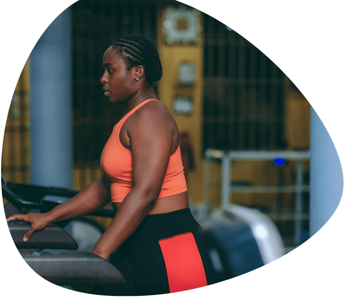 Woman exercising at a gym, representing women’s health insurance in Dublin