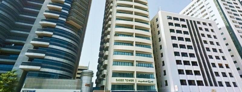 White Swan Building situated next to Saeed Tower 1, showcasing premium residential real estate options.