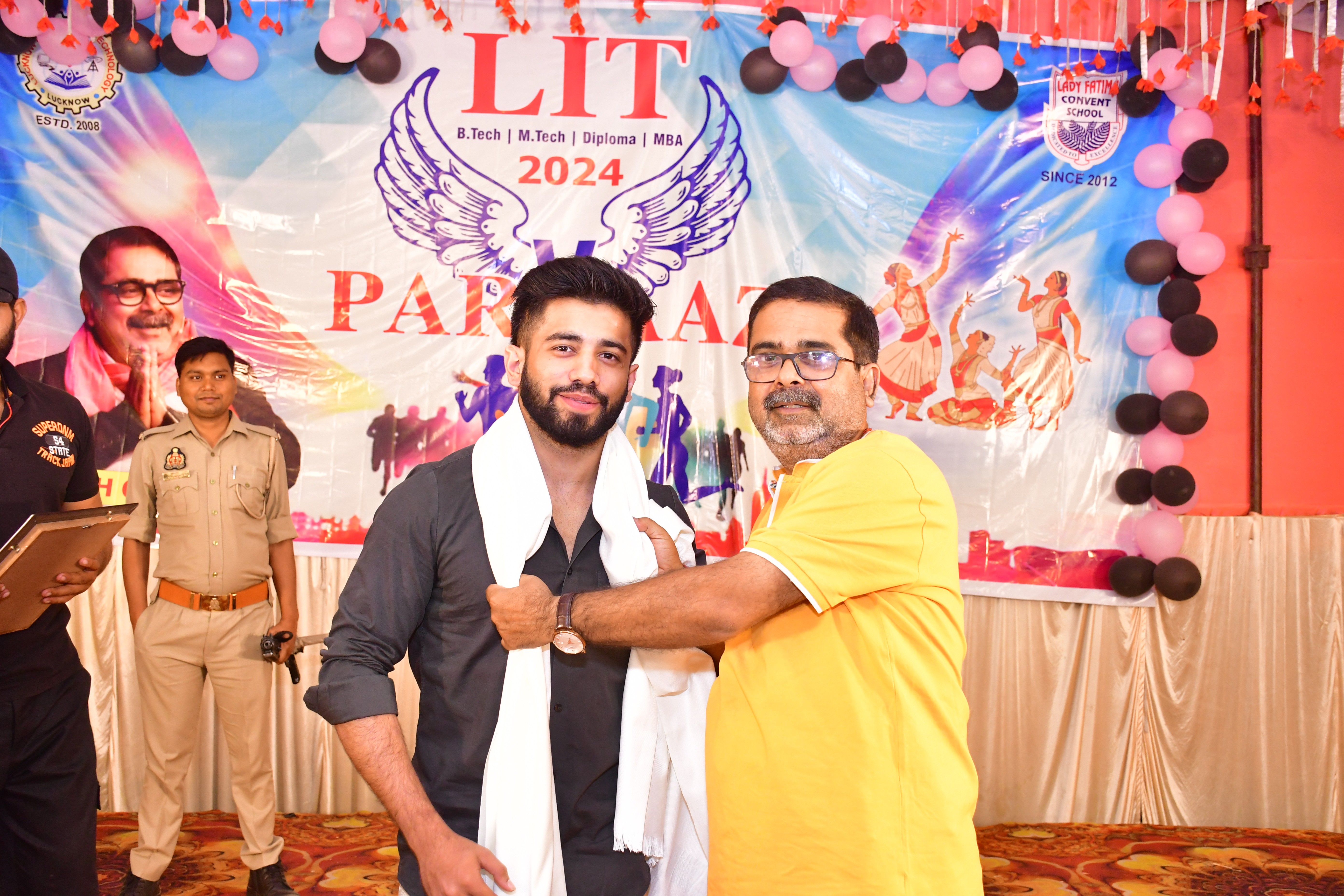 people sitting on chair in front of table while holding pens during daytime
