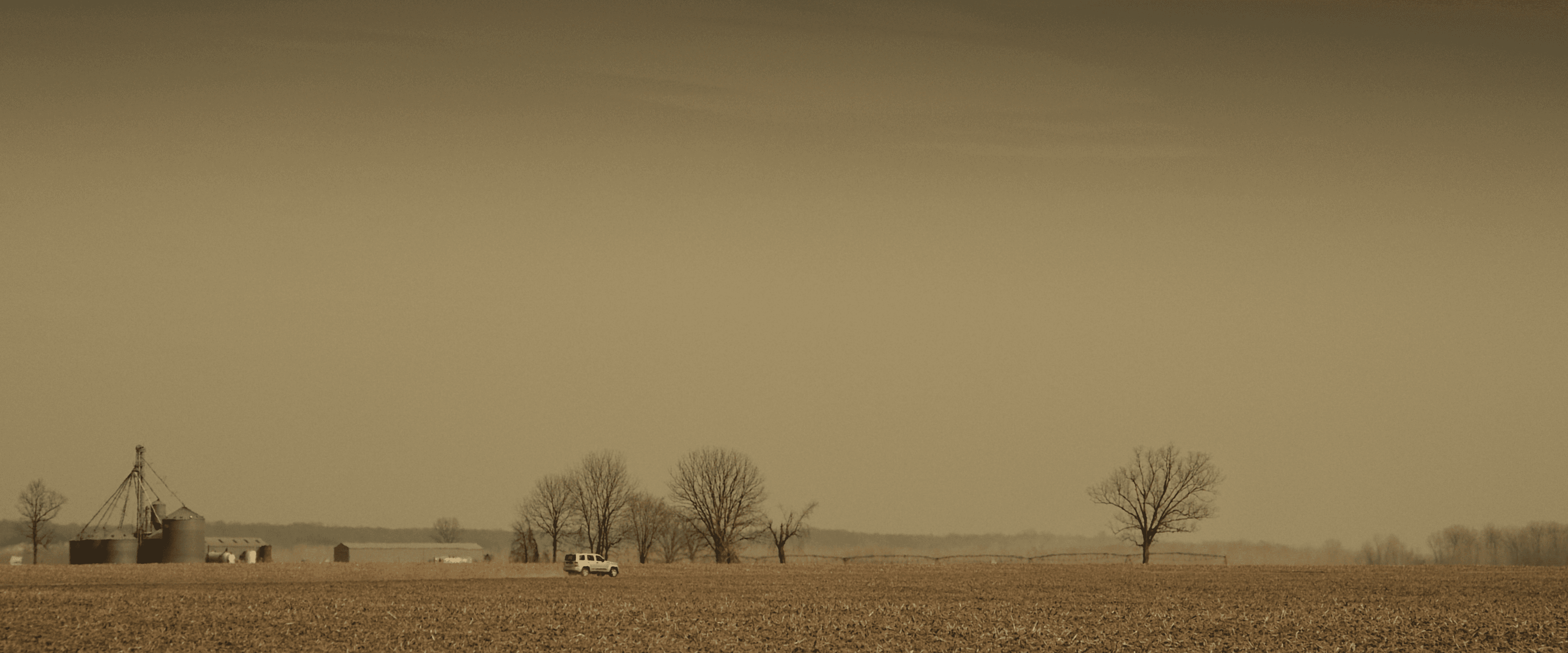 Pen, papers, and color palette swatches on a sunlit desk.